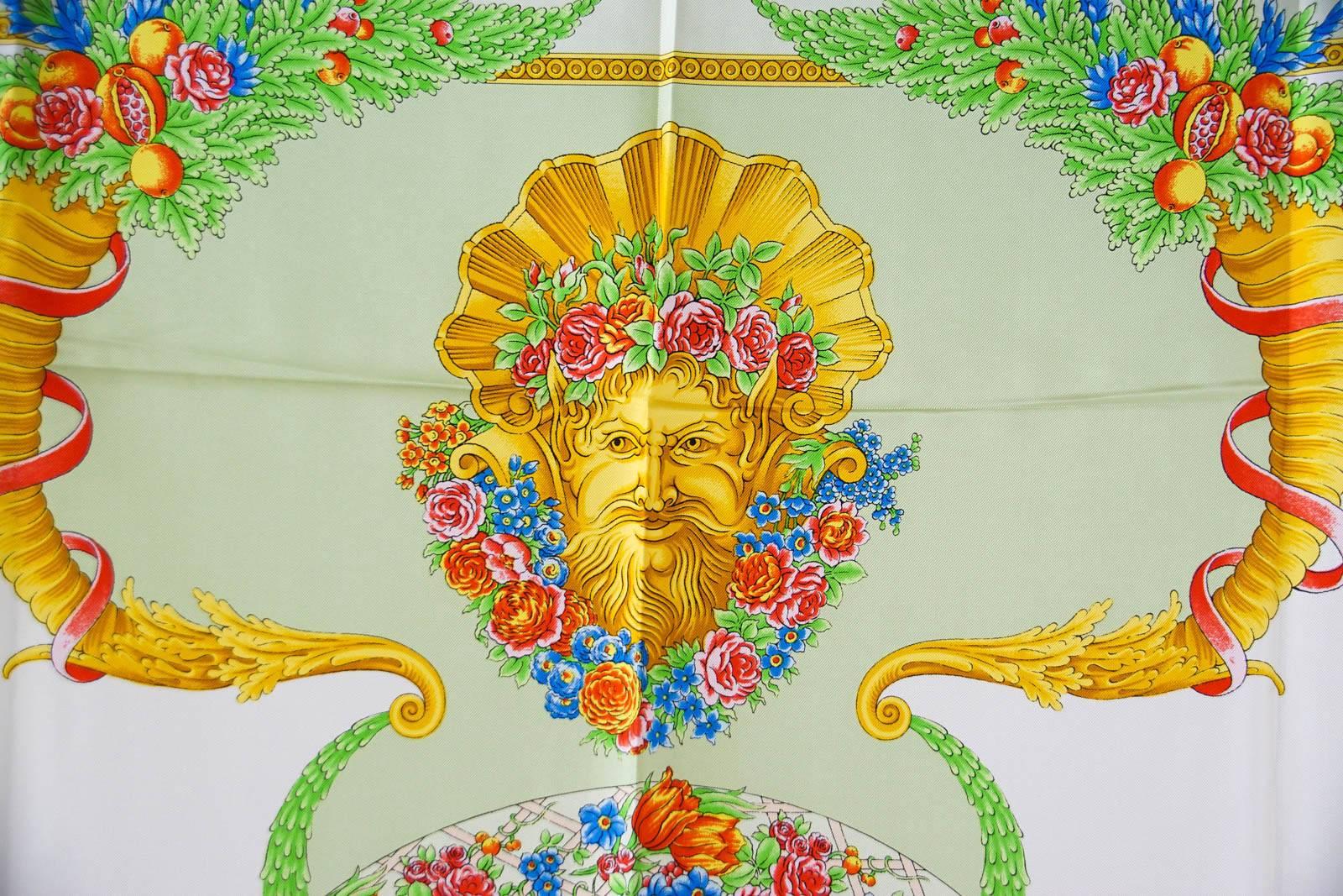 Guaranteed authentic GIANNI VERSACE ATELIER Vintage scarf Garden motif hand rolled edge.
Beautiful Idyllic Garden silk scarf.
In shades of green, gold, red, blue and pink.
Extraordinary!
1 small thread pull.
final sale

SCARF MEASURES:
34" X 