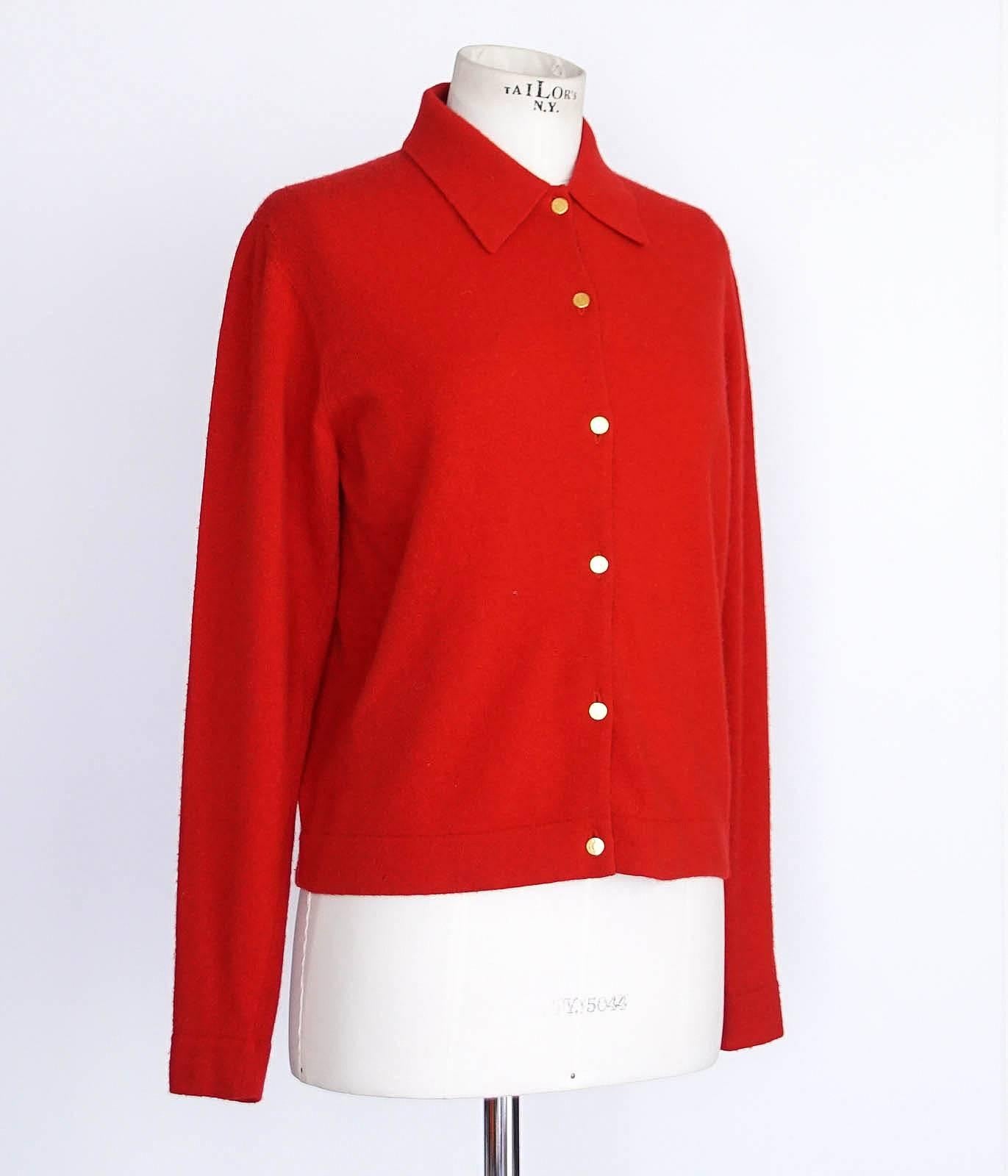 Guaranteed authentic HERMES red cashmere cardigan sweater. 
Vintage peak collar front button cardigan in a rich red.
6 gold embossed buttons.
Fabric is 100% cashmere.
final sale

SIZE XL

CARDIGAN MEASURES: 
LENGTH   24