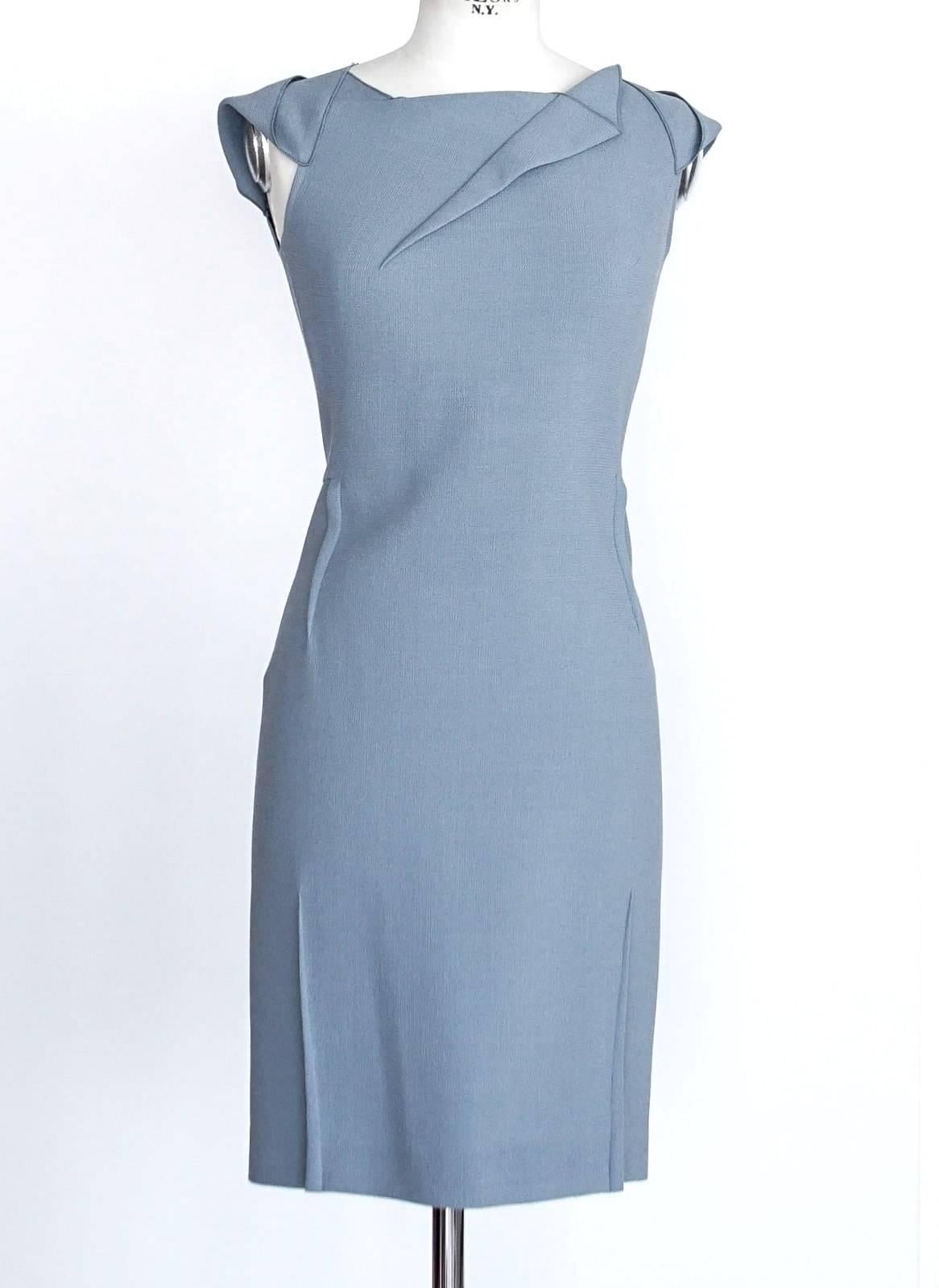 Guaranteed authentic ROLAND MOURET architecturally styled dress.
A versatile work/luncheon/cocktail dress.
Beautifully cut blue gray dress with exquisite detail.
Textured wool fabric with bold rear zip.
final sale

SIZE 8
 
DRESS MEASURES:
LENGTH 