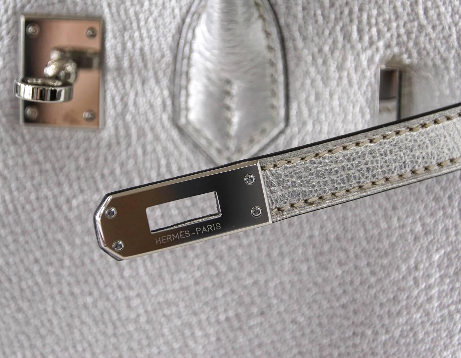 Guaranteed authentic Hermes Birkin 25 Chevre uber rare, crazy fabulous, Metallic Silver.
Perfection with palladium hardware.
Black chevre interior.
Comes with lock, keys, clochette, sleepers, raincoat and signature Hermes box.
MINT
final sale

BAG