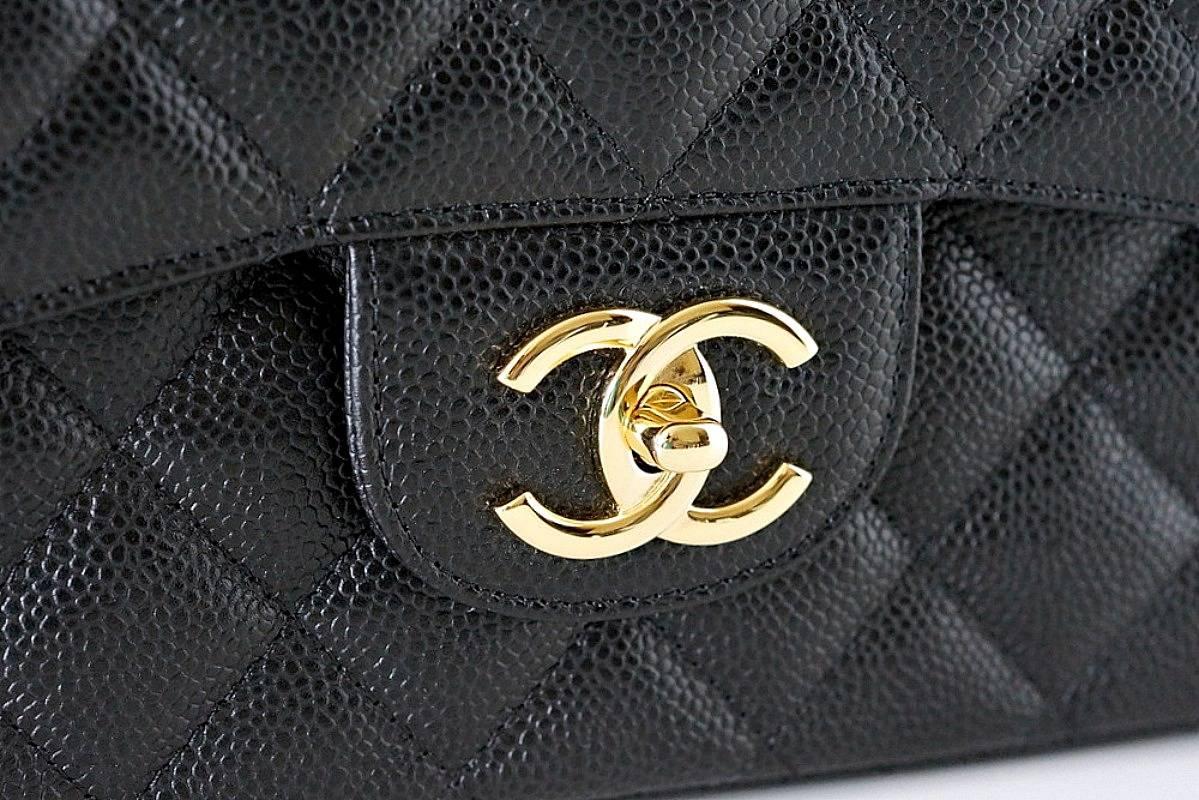 Guaranteed authentic superb Maxi double flap bag in timeless black caviar. 
Chanel classic with coveted gold hardware. Impossible to find this coveted beauty.
Rear exterior slot pocket.
Signature interior pockets. 
Signature CHANEL stamp inside the