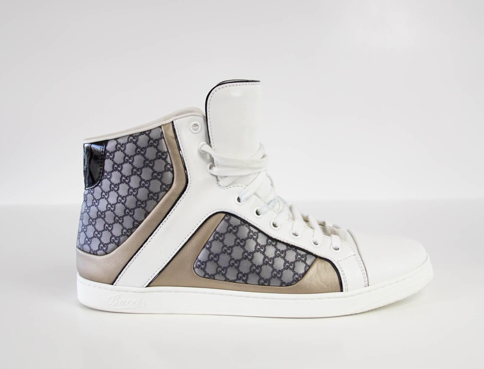 Guaranteed authentic Gucci men's white leather high top sneaker with embossed grey monogram and gold trim.
Black patent leather GG at rear and trim.
Comes with signature box.
final sale

USA SIZE  9.5 G

CONDITION:
MINT
