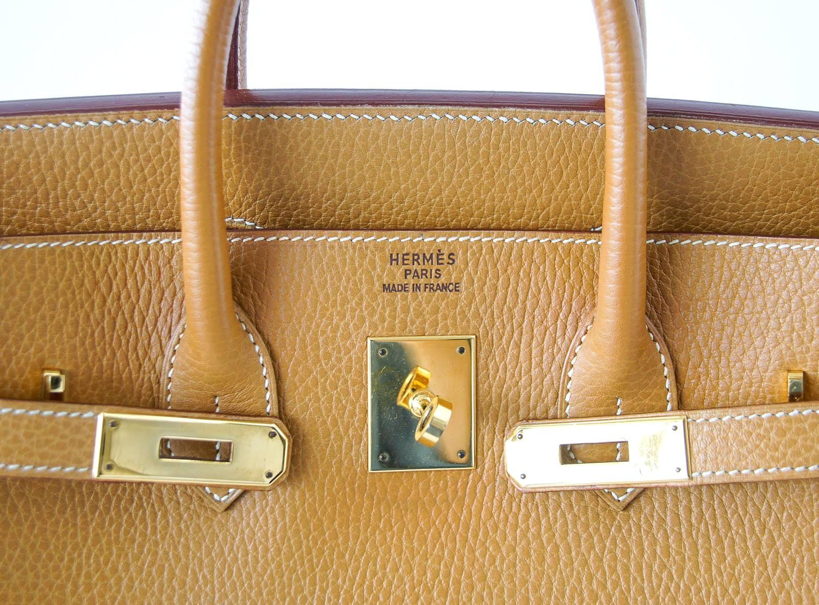 Guaranteed authentic Hermes Hac 32 Birkin in rare Natural Ardennes leather.
No longer produced, coveted Ardennes leather is considered a work horse,  keeping the shape of the bag.  It is also water and scratch resistant.
The leather is pressed and