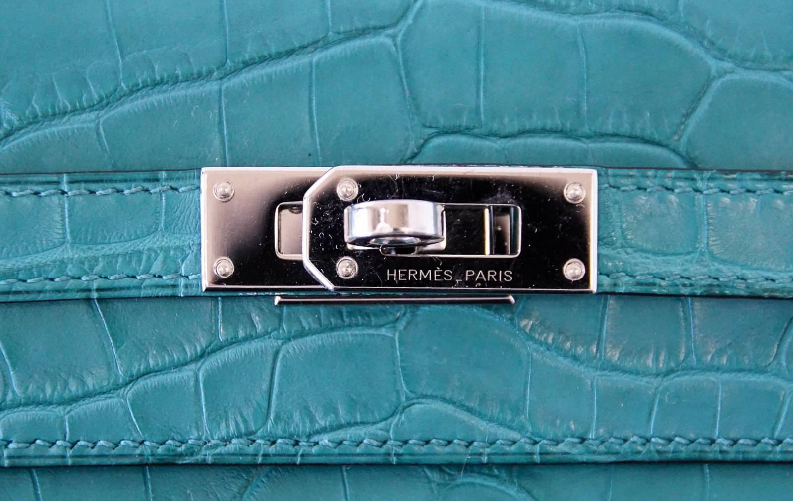 Guaranteed authentic timeless matte Alligator Hermes Kelly Long Wallet.
Often carried as a clutch this Blue Paon beauty is a jewel in your hand.
The perfect pop of rich colour for any outfit.
Palladium hardware.
Carried only 2 or 3 times in perfect