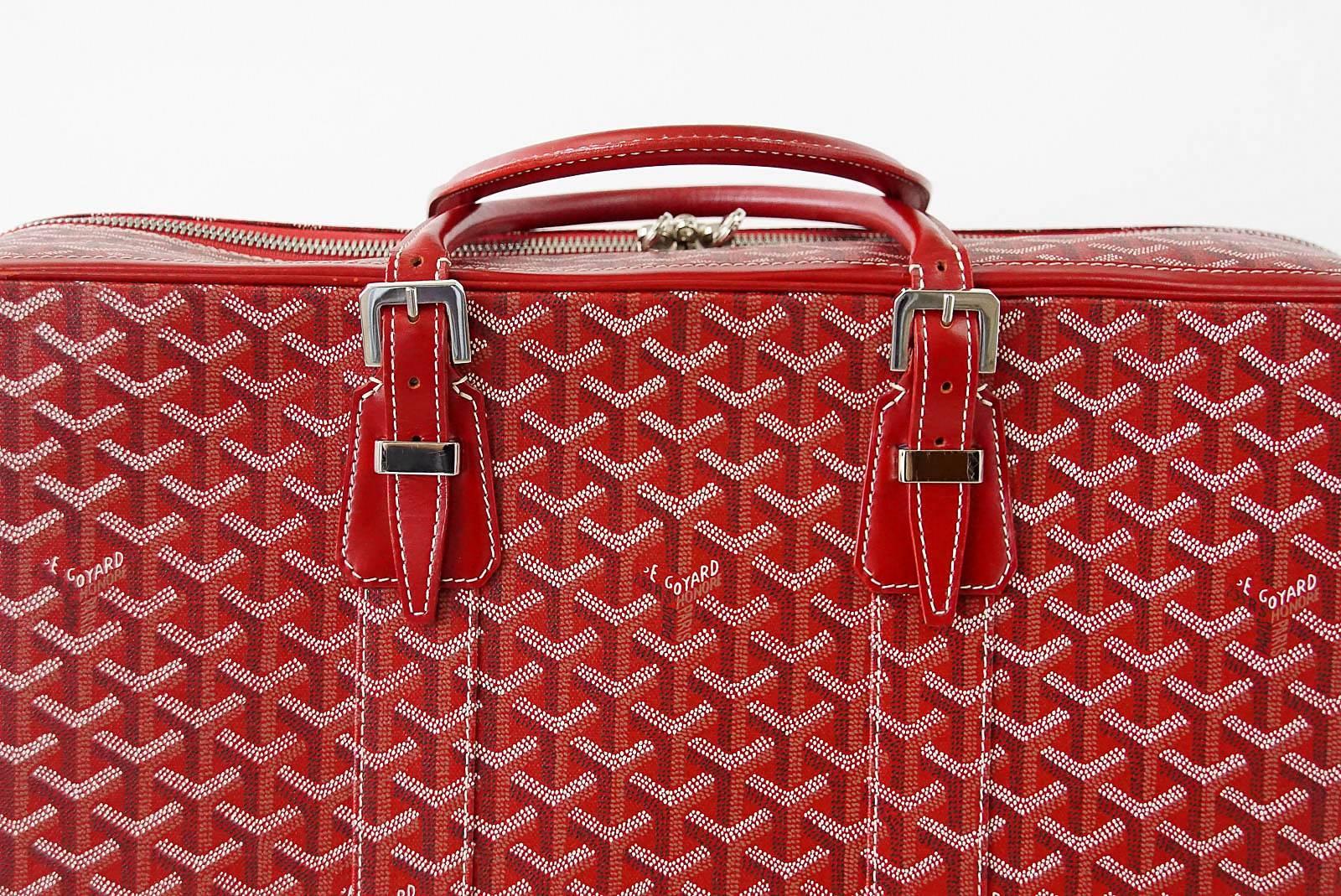 Guaranteed authentic Goyard red signature monogram soft sided zip around suitcase.  
Comes with palladium fittings, lock and keys.
Case interior has a back slot pocket with leather closure and small zip pocket.
Interior is lined in signature yellow