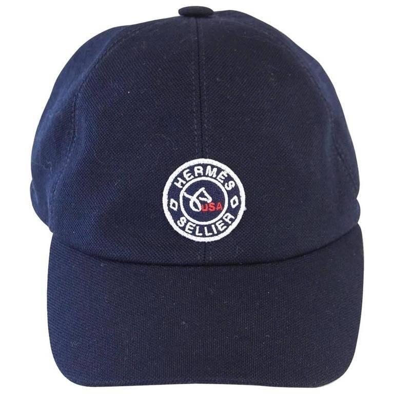 Guaranteed authentic Limited Edition Sold Out Hermes navy blue Equestrian cap. 
Produced for the US Equestrian team.
The cap has the official Clou de Selle, the Hermes saddle nail, logo in the front.
2 HERMES PARIS logo snaps just below a USA flag