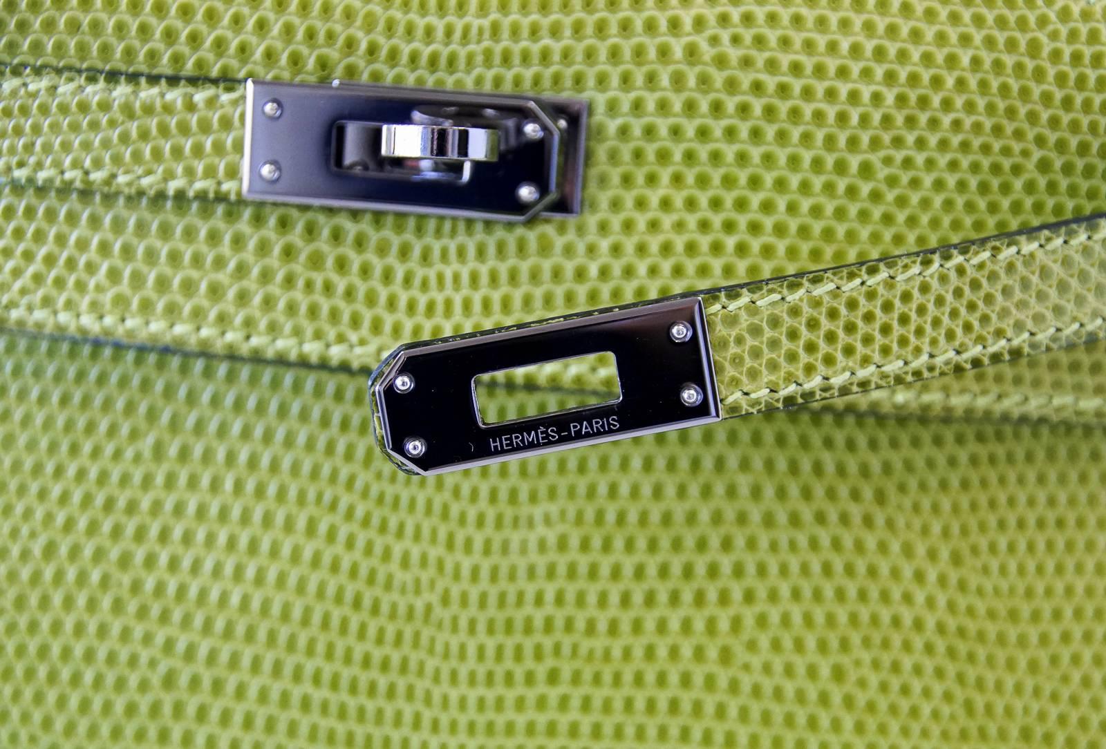 Guaranteed authentic Hermes Kelly Pochette Clutch bag Vert Anis very rare Lizard.
Fresh with Palladium hardware.
Signature stamp on interior.
Small interior compartment.
Mirror clean hardware.  
Clean handle, corners, body and interior.
Comes with