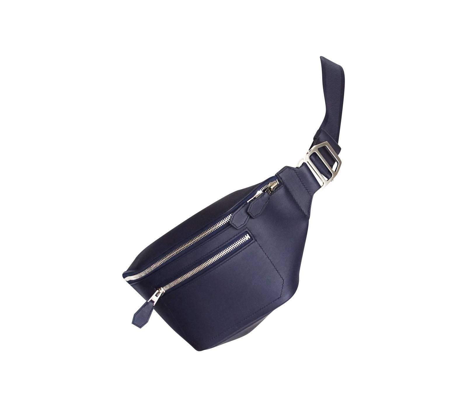 Guaranteed authentic Limitied Edition Hermes Sac Cityslide Cross PM rare Taurillon Cristobal Leather with Sangle Twill strap.
Versatile waist bag in Blue Indigo.
Adjustable strap allows the bag to be worn cross body or around waist.
Comes with