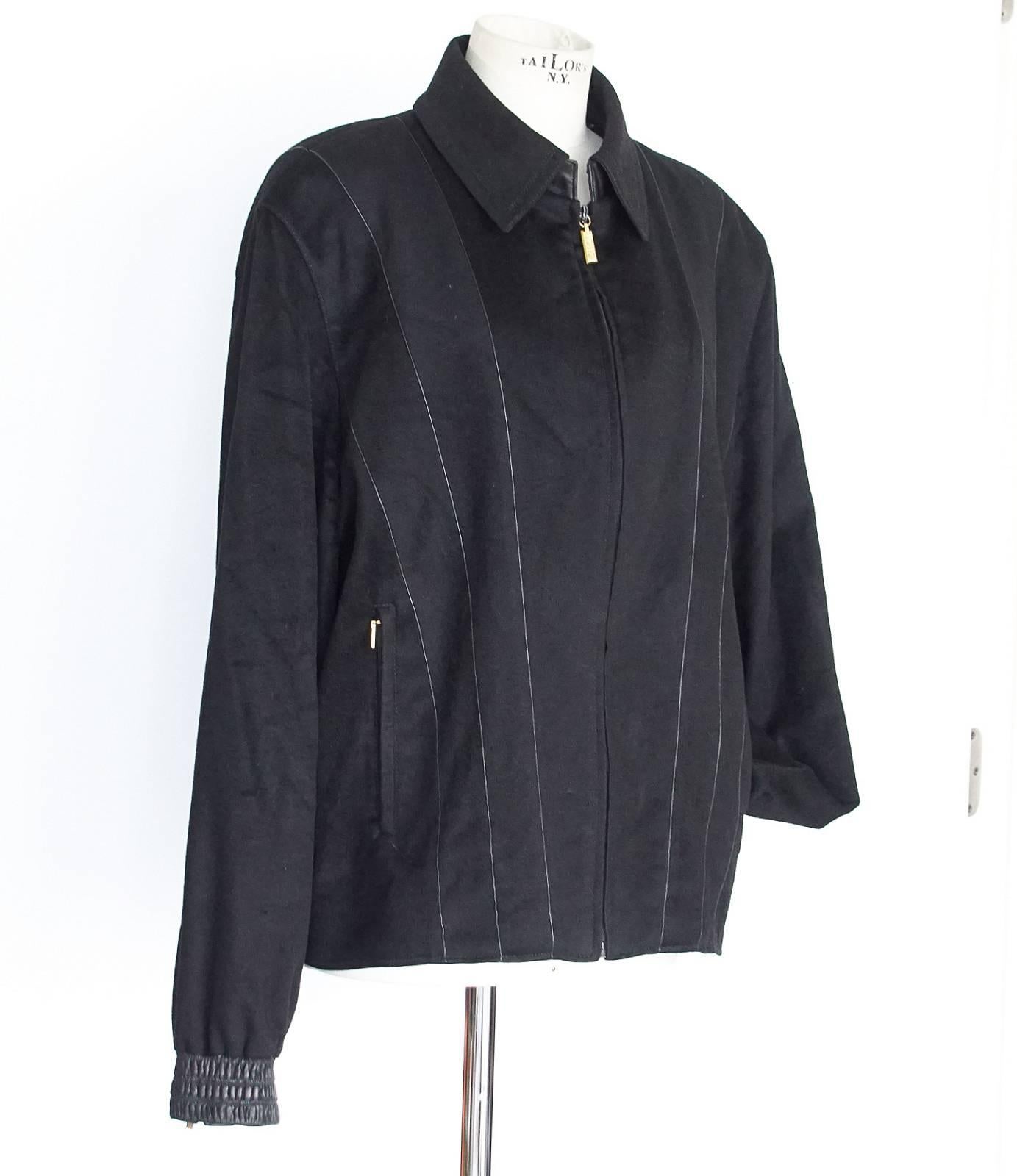 Guaranteed authentic Zilli men's black exquisite cashmere and leather accented bomber styled jacket created in 'panels' 
with very fine leather piping accentuating each one.  
Remarkable workmanship and fabric quality sets this label apart.
Collar