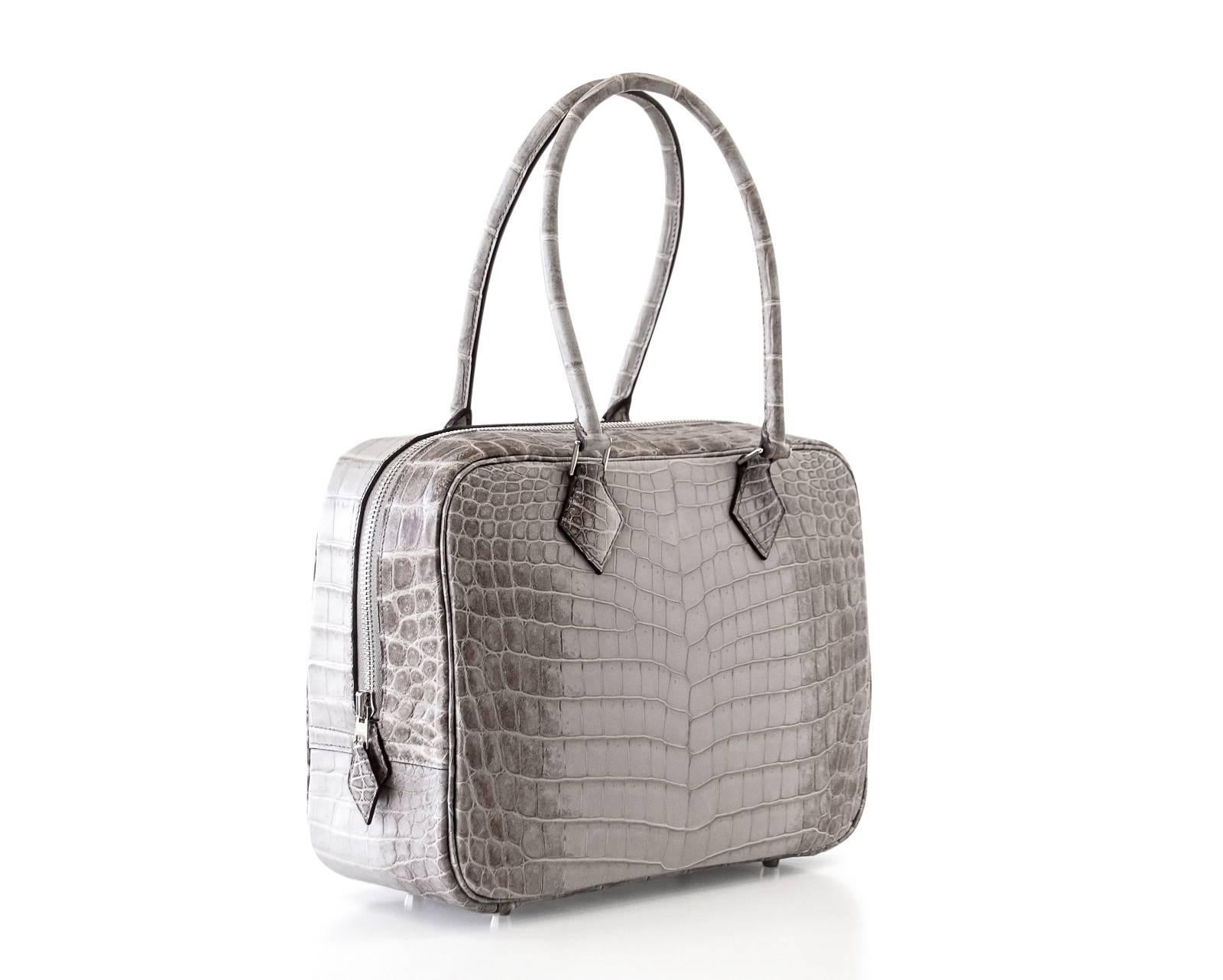 Guaranteed authentic Hermes Plume 28 Bag in rare Gris Cendre Himalaya.
The most rare colour in Himalaya is just as extremely rare in a Plume.
The ultimate chic bag that sets you apart.
Beautiful scales and gradation of hue.
Comes with sleeper and