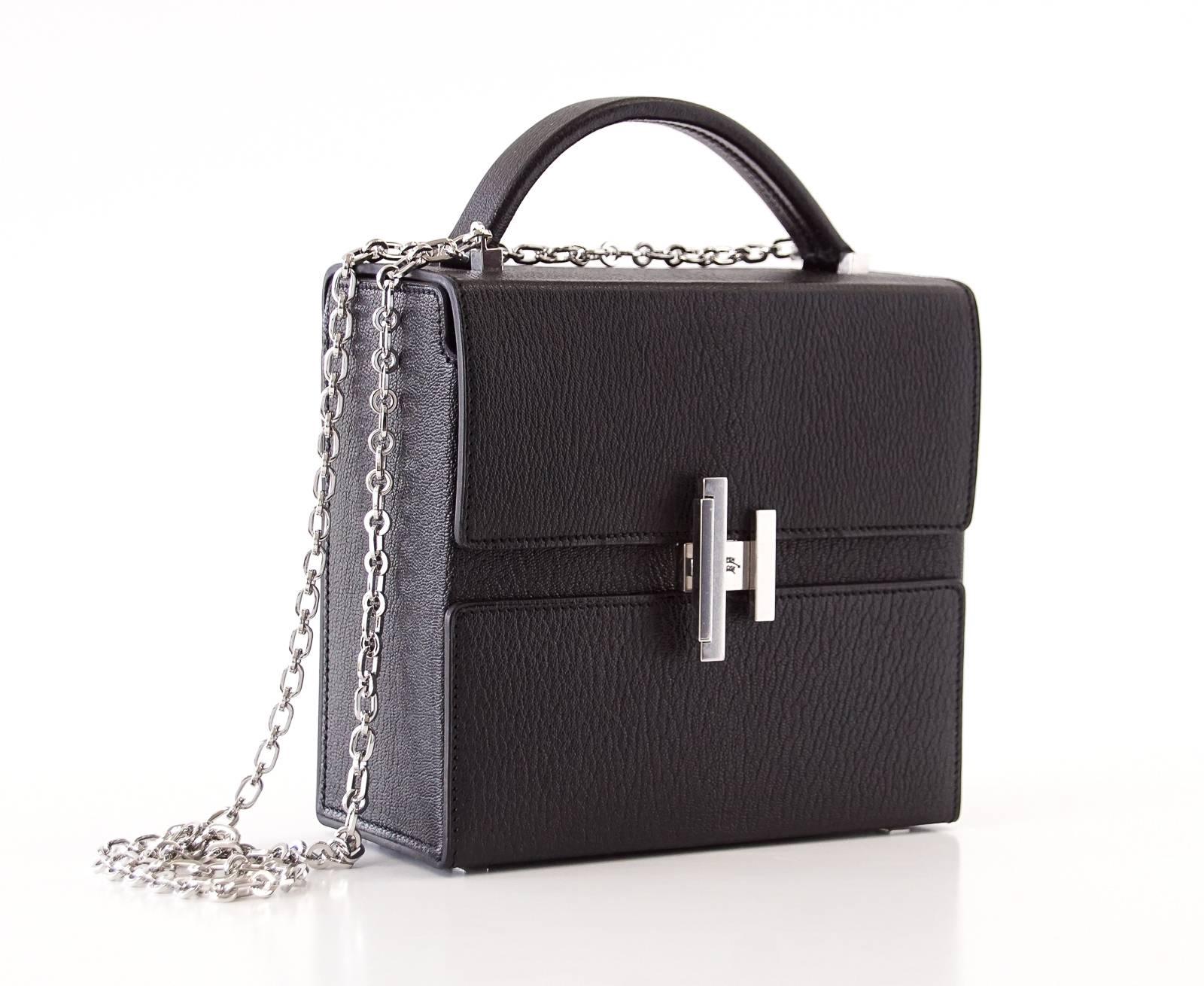 Guaranteed authentic Hermes Cinhetic Runway Limited Edition bag.
Black coveted Chevre leather and palladium hardware.
Fresh new shape with architectural H that turn easily to open. 
Top handle and beautifully designed chain link shoulder