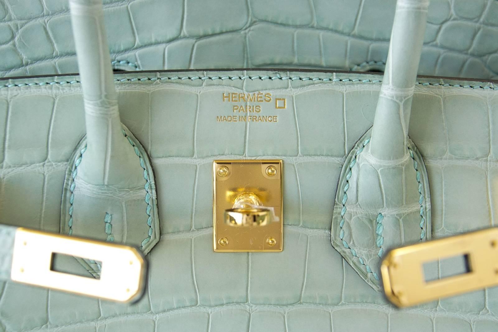 Guaranteed authentic Hermes Birkin 25 Bag rare Vert D'Eau is nothing less than translucent Carribean water.
Breathtakingly beautiful this is a testament to the Hermes World of Colour.  
Warmed  with gold hardware in Matte Alligator.
Comes with lock,