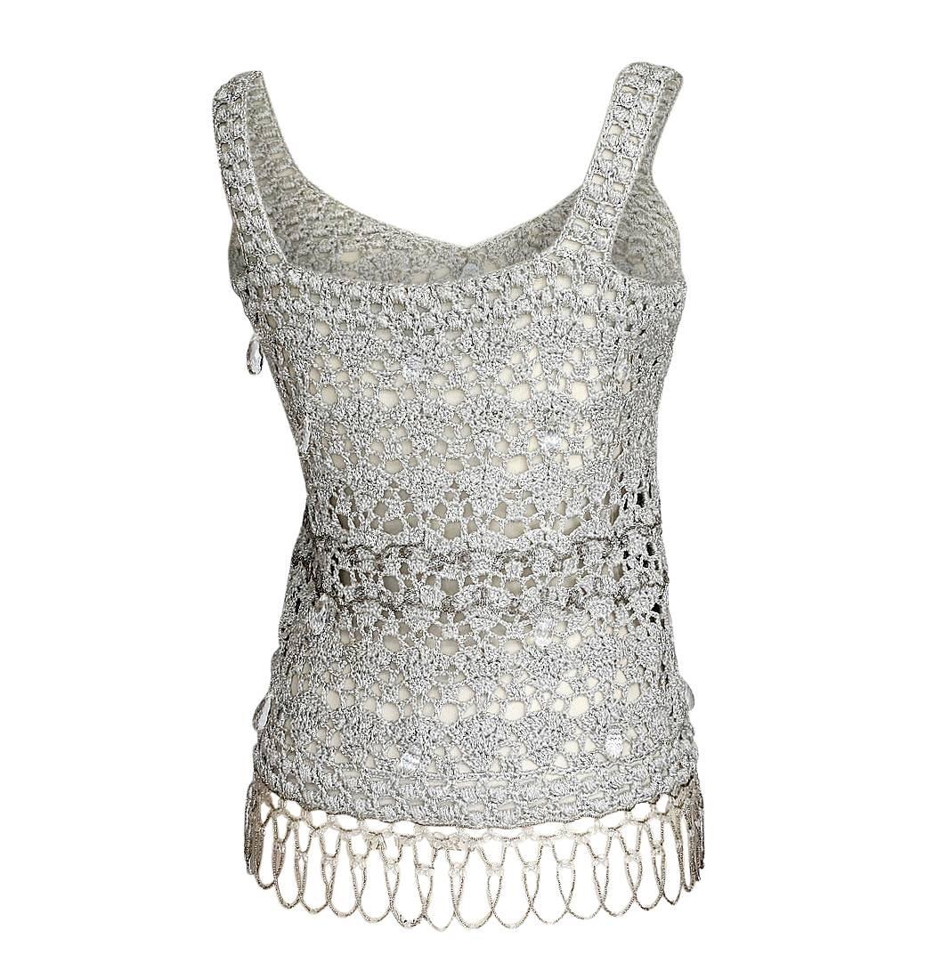 Guaranteed authentic John Galliano silver crocheted with beads and lucite crystals top.
Large, faceted clear crystals drops scattered all over.
Marvelous effect as they catch the light when you move. 
The waist area has tiny clear beads.
The hem is