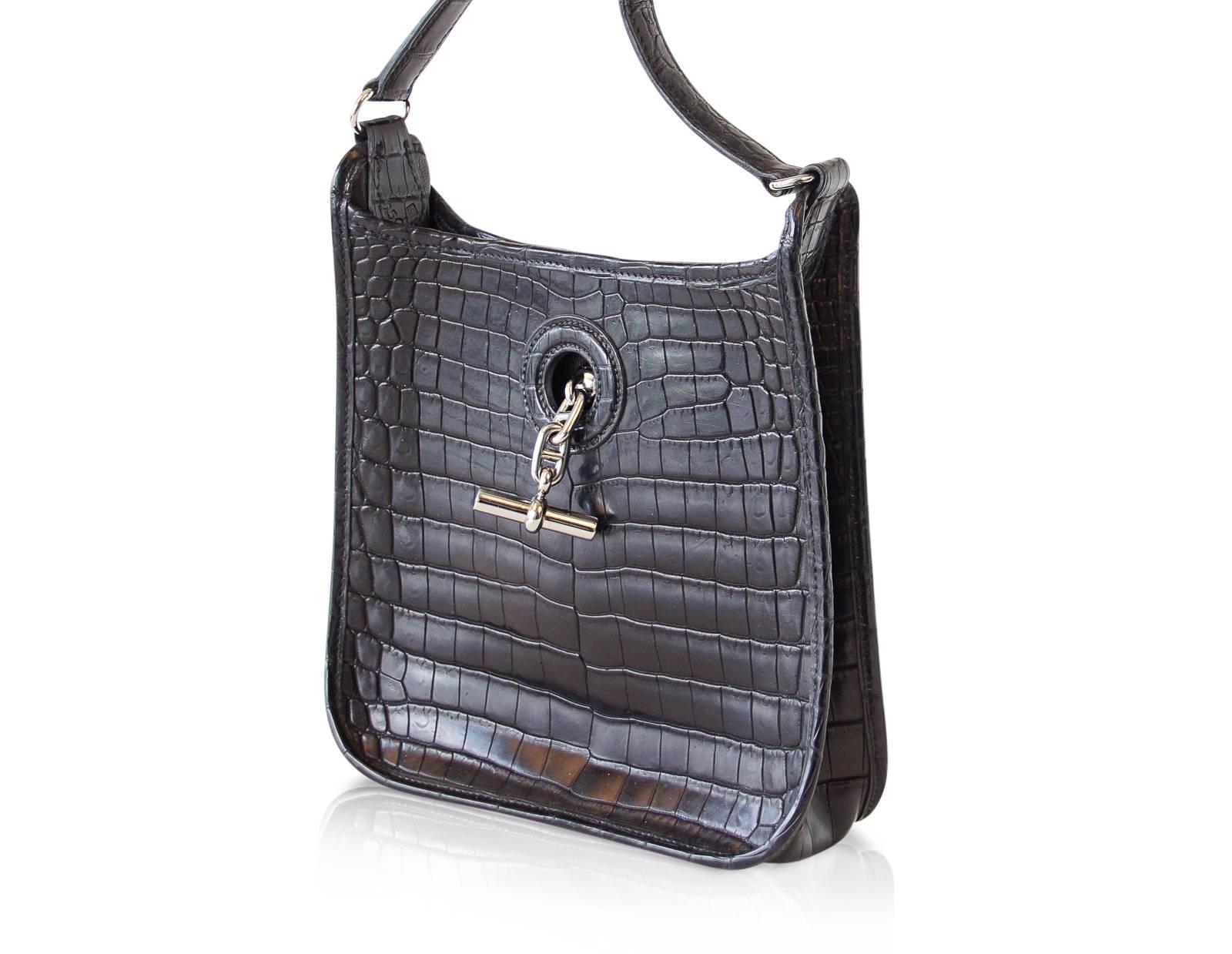 Rare Hermes TPM Vespa in jet black matte crocodile.
Iconic palladium Chaine d'Ancre toggle for closure. 
Rare to find in crocodile this beauty will set you apart from the TPM Evelyne and will surely become your 'go to' cross body! 
Timeless and an