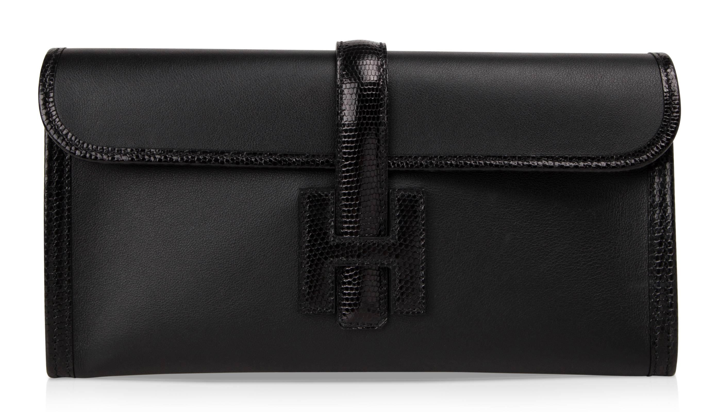 Guaranteed authentic Hermes Jige Elan in jet Black Swift Leather accentuated with Black Lizard.
This exquisitely beautiful bag is sophisticated and elegant. 
Comes with sleeper and signature orange Hermes box.
NEW or NEVER WORN 
final sale

BAG