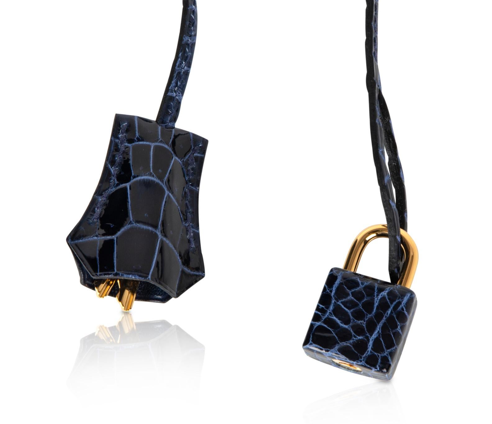 Mightychic offers a guaranteed authentic jewel toned Hermes Birkin 35 bag featured in Blue Sapphire Porosus Crocodile. 
This Hermes Birkin is not unlike a faceted sapphire.  A gorgeous jewel.
Lush with Gold hardware.
Comes with lock and keys in the