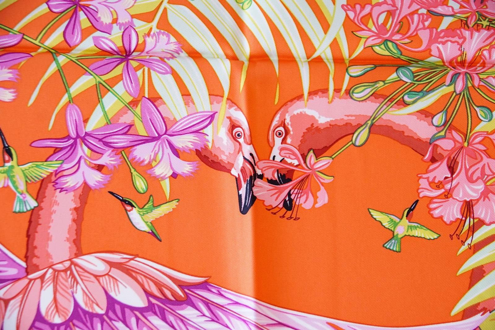 Guaranteed authentic limited edition Hermes Flamingo Party silk scarf created for the opening of the Miami Hermes store. 
Exotic lush plants and flowers with Flamingos and hummingbirds.
Rich Fuschia pink, orange, navy and greens.
HERMES - MIAMI