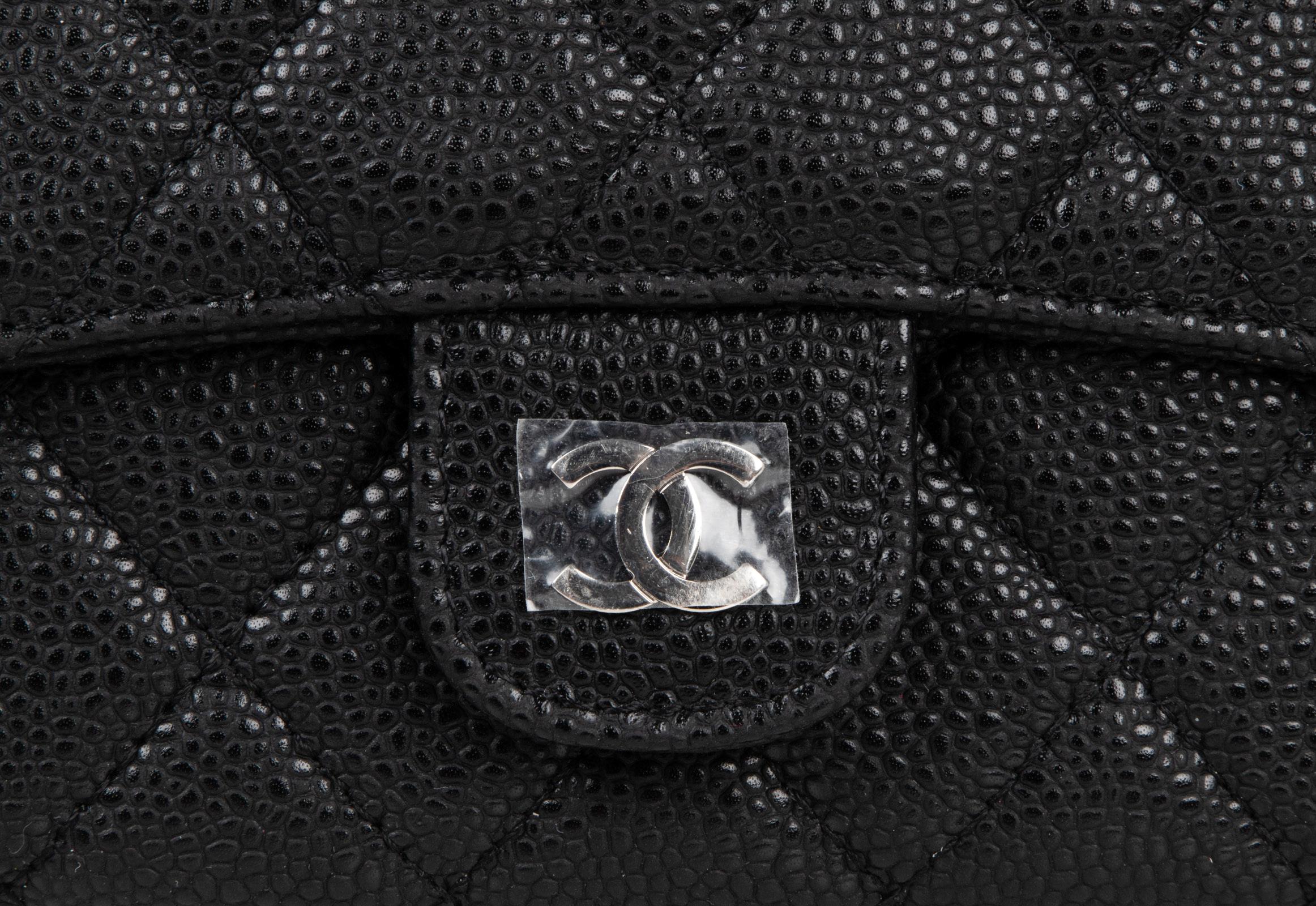 Guaranteed authentic Chanel Classic Flap Long black clutch style wallet in quilted caviar leather with CC snap closure. 
Interior is rich brown leather and has 6 credit card slots.
Checkbook slot and change purse with embossed snap close. 
Comes