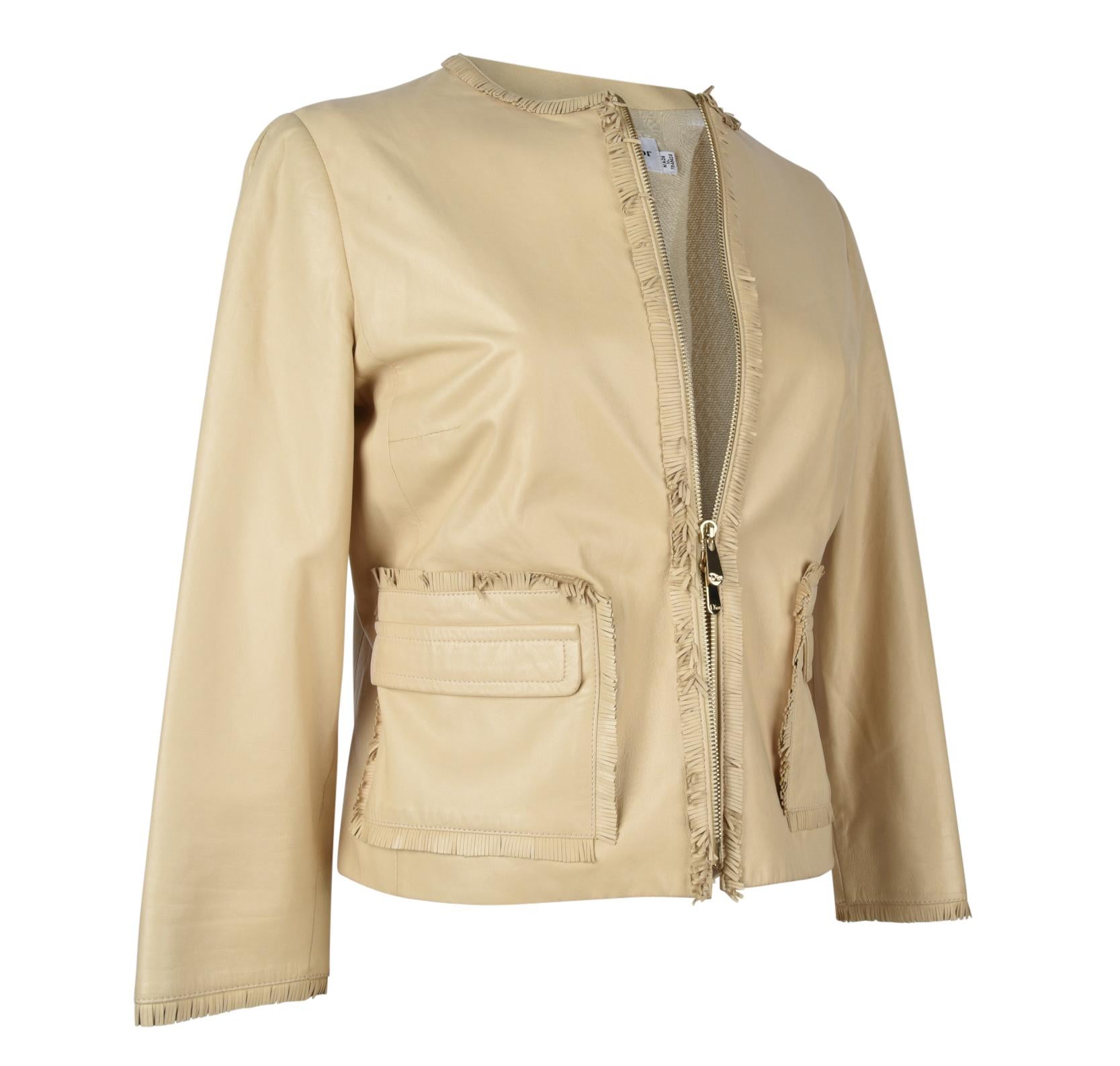 Guaranteed authentic Christian Dior lambskin leather jacket in pale butter yellow.  
Front zip with embossed pull.
Jacket is trimmed with a small fringe around neck, down front and around pockets.
2 patch flap pockets.
Lined in silk. 
final