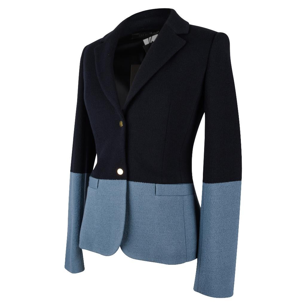 Guaranteed authentic The Row beautifully shaped navy and slate blue colour block jacket.
2 gold toned snap buttons. 
2 flap pockets.
No buttons on cuffs.
Fabric wool and acrylic.
NEW or NEVER WORN.  Tags attached.
final sale

SIZE 4
USA SIZE 6 /