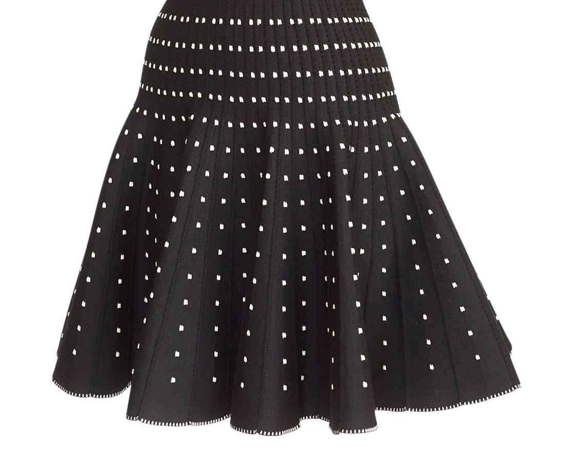 Mightychic offers an Azzedine Alaia black knit dress with small silver metallic embroidered detail.
Designed by Azzedine Alaia. 
Scoop neck with the iconic Alaia fit.
Small silver embroidery creates varying pattern in detailed black knit.
Flare