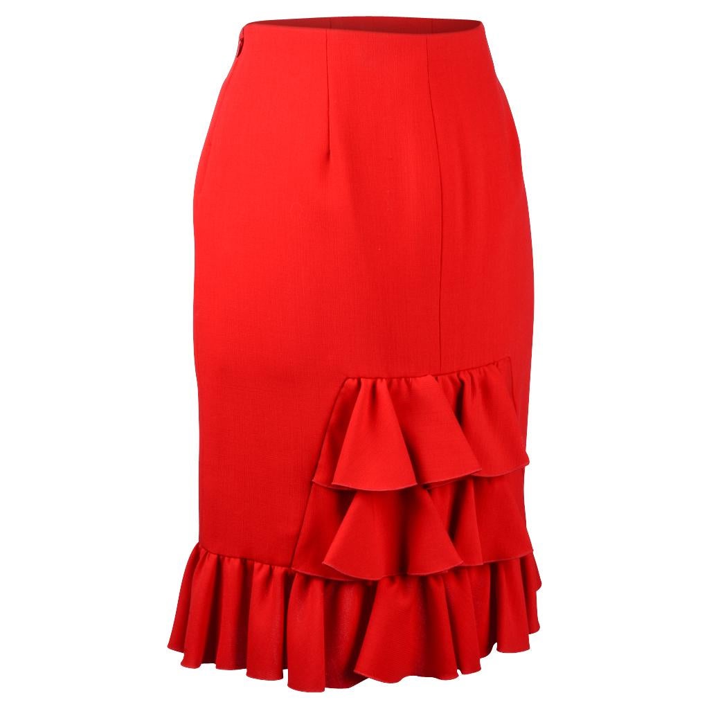 Guaranteed authentic marvelous Valentino signature red skirt with a ruffle hem.
Rear has flutter ruffles.
Straight cut with a hidden side zipper. 
Skirt is fully lined.
Fabric is wool and elastane.
Quintessential Valentino.
The color is superb.
NEW