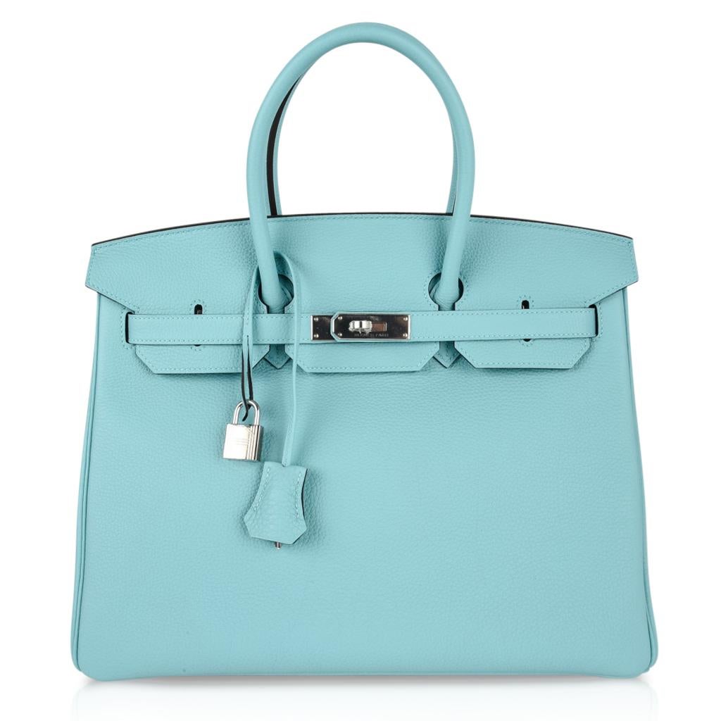 Exquisite Blue Atoll togo leather with palladium.
Think summer breeze and this is the colour that comes to mind!
Comes with lock, keys, clochette, sleepers, raincoat and signature Hermes box.
NEW or  NEVER WORN
final sale

BAG MEASURES:
LENGTH  35cm