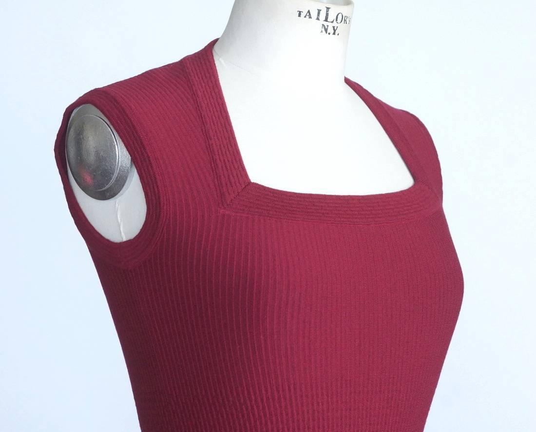 Guaranteed authentic ALAIA superbly shaped knit dress.
Sleeveless with a trapezoid angled shaped neckline.
Subtle knit pattern detail at waist. 
Hidden side zipper.
Fabric is viscose and polyester.
New or Never Worn.  Tag attached.
final sale

SIZE