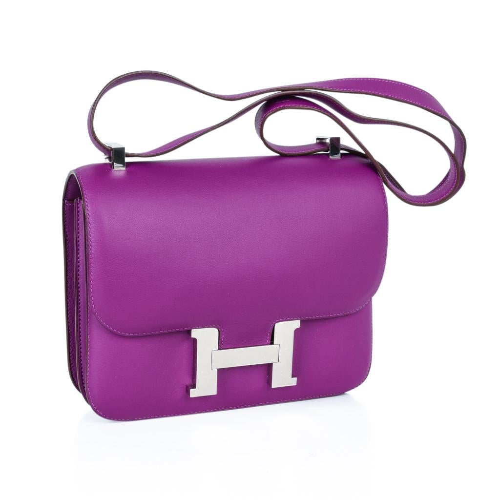 Mightychic offers an coveted Hermes Constance 24 bag featured in jewel toned Anemone with palladium hardware.
Carried by hand, over the shoulder, or even across the body!
HERMES PARIS MADE IN FRANCE is stamped on front under flap.
NEW or NEVER