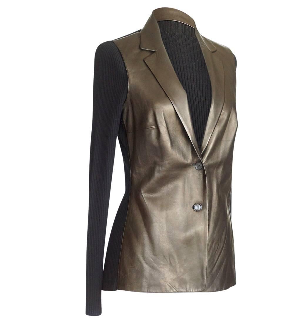 Mightychic offers a Gucci lambskin and wool cardigan.
Cardigan with a pearlized gunmetal lambskin front and ribbed black wool rear and sleeves.
Buttery soft lambskin with notched lapels.
2 embossed buttons in front.
Fabric is lambskin and