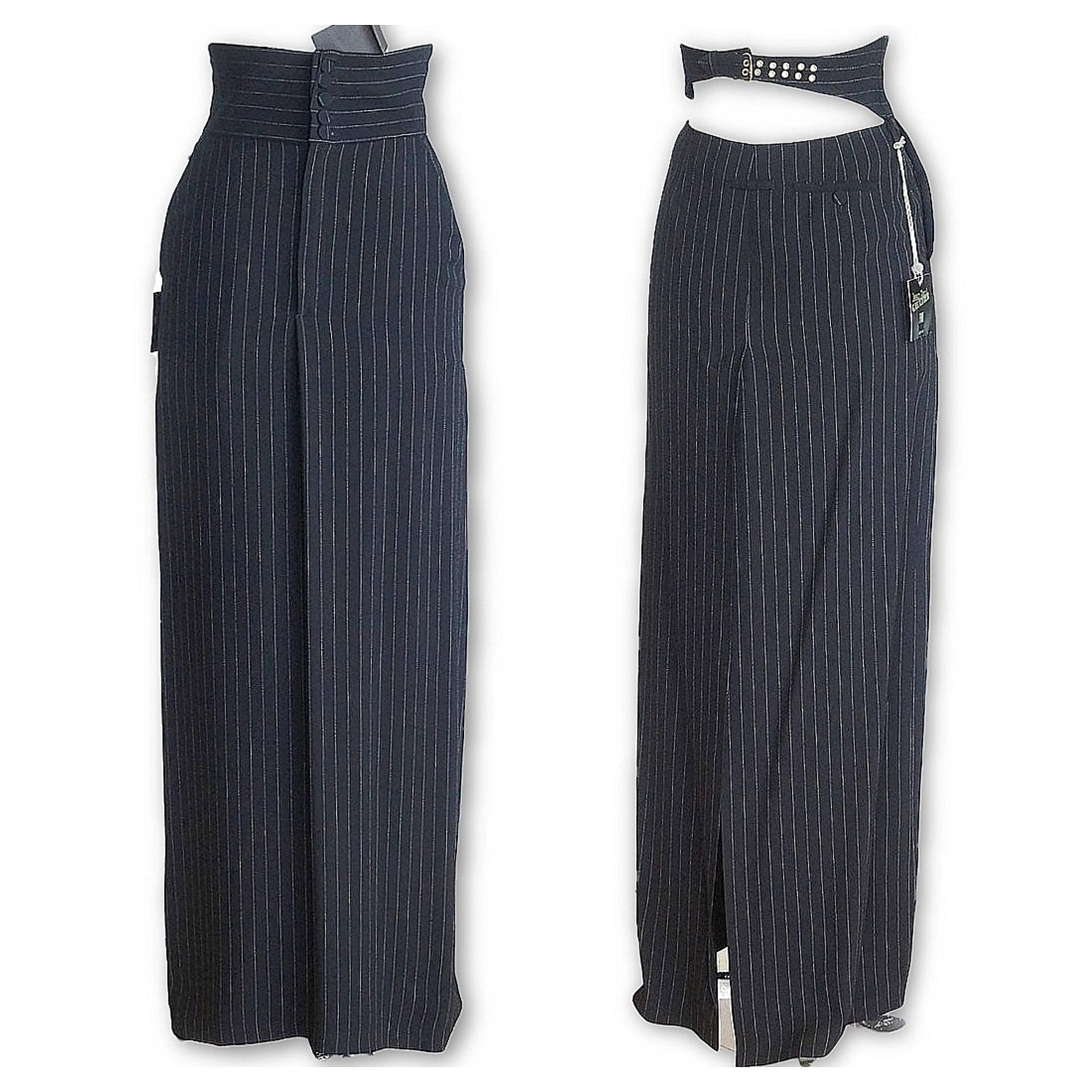 Guaranteed authentic JEAN PAUL GAULTER vintage long pinstripe pencil skirt with sensational details. 
Front effect is a high waisted trouser cumberband 5 covered buttons. 
Front fly zip and soft pleat in center.
2 Angled pockets.
Rear  cumberbaund