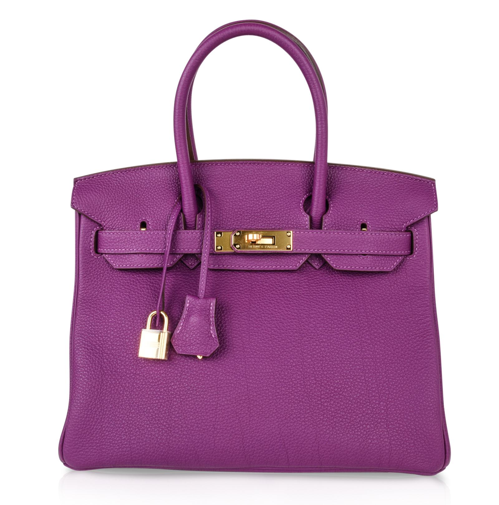 Guaranteed authentic Hermes Birkin 30 luxurious Anemone retired colour purple.
Togo leather with gold hardware.
This exquisite pre owned bag has immaculate corners, body, handles and interior.
Brand new strap gold hardware.   Lock is still in