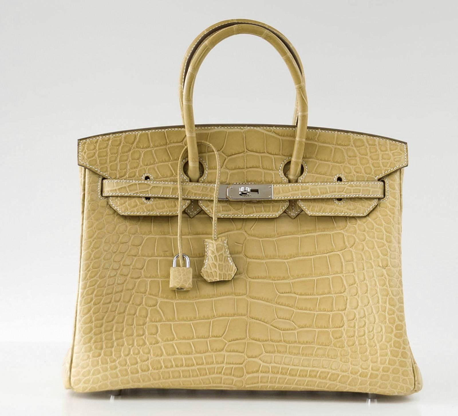 Guaranteed authentic Hermes Birkin 35 Mais matte Alligator.
This unique colour is best described as a buttery blonde beige yellow to the eye.
Fresh palladium hardware.
Front has 2 very light marks.
Carried one time. 
Plastic on feet. No markings on