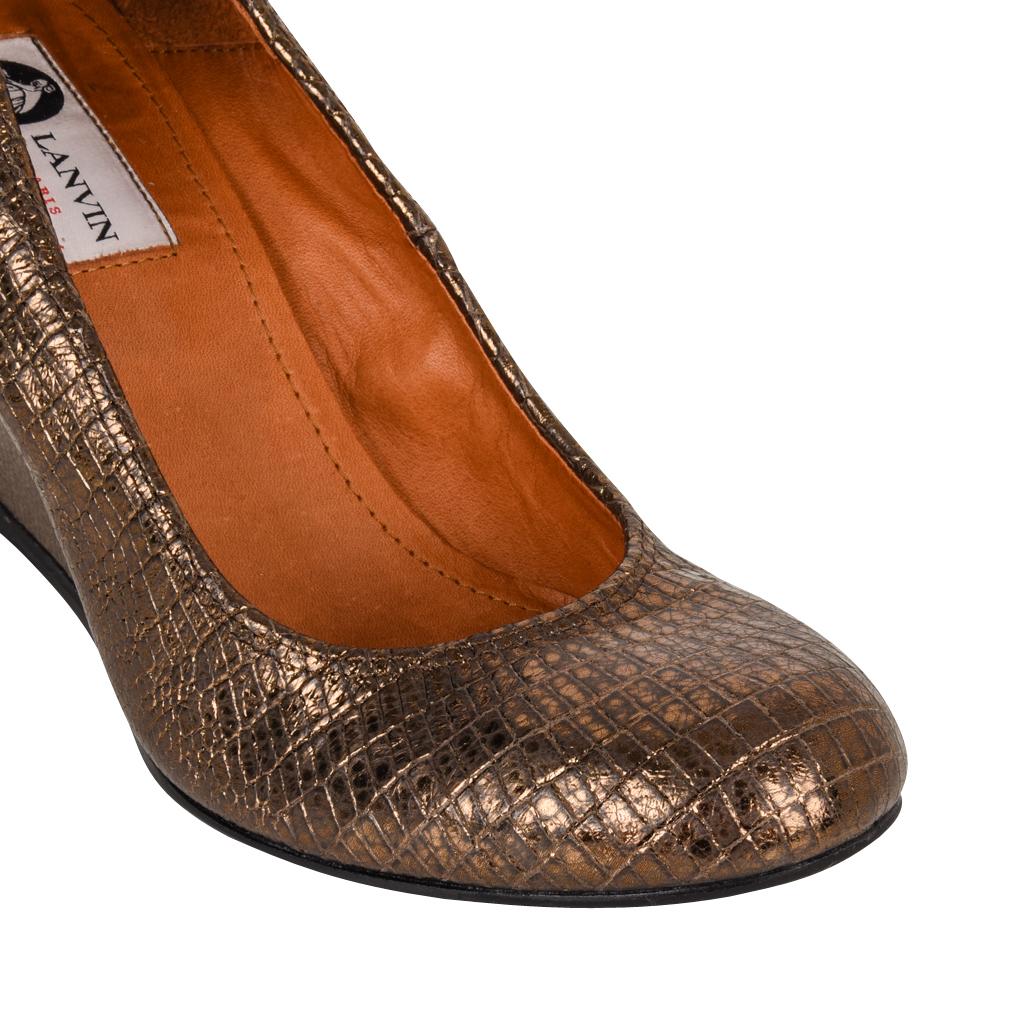 Guranteed authentic Lanvin  ballet style pump with a full wedge.
The colour is a totally neutral golden bronze with subtle metallic wash.
The leather on the foot is stamped to look like lizard.
The leather on the wedge is textured.
Smashing