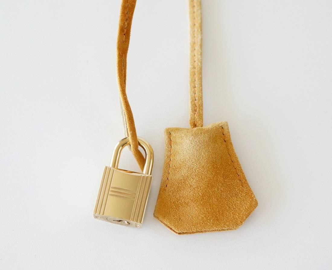 Guaranteed authentic Hermes rare doblis (suede) Birkin.
Year round neutral in Camel with lush gold hardware. 
Plastic still on strap hardware and turnkey plate.
Lock is like new. 
Corners, handles and interior are clean.
Body, handles and