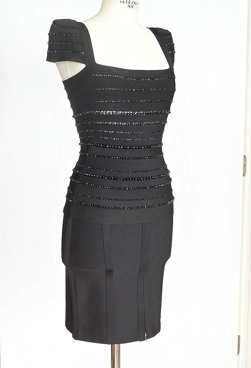 Guaranteed authentic Herve Leger  jet black bandage skirt set.
Beautifully shaped beaded cap sleeve top with square neckline.
Black faceted beads in varying sizes set in all around in 'open' seams. Gorgeous sparkle as you move!
Top zips at