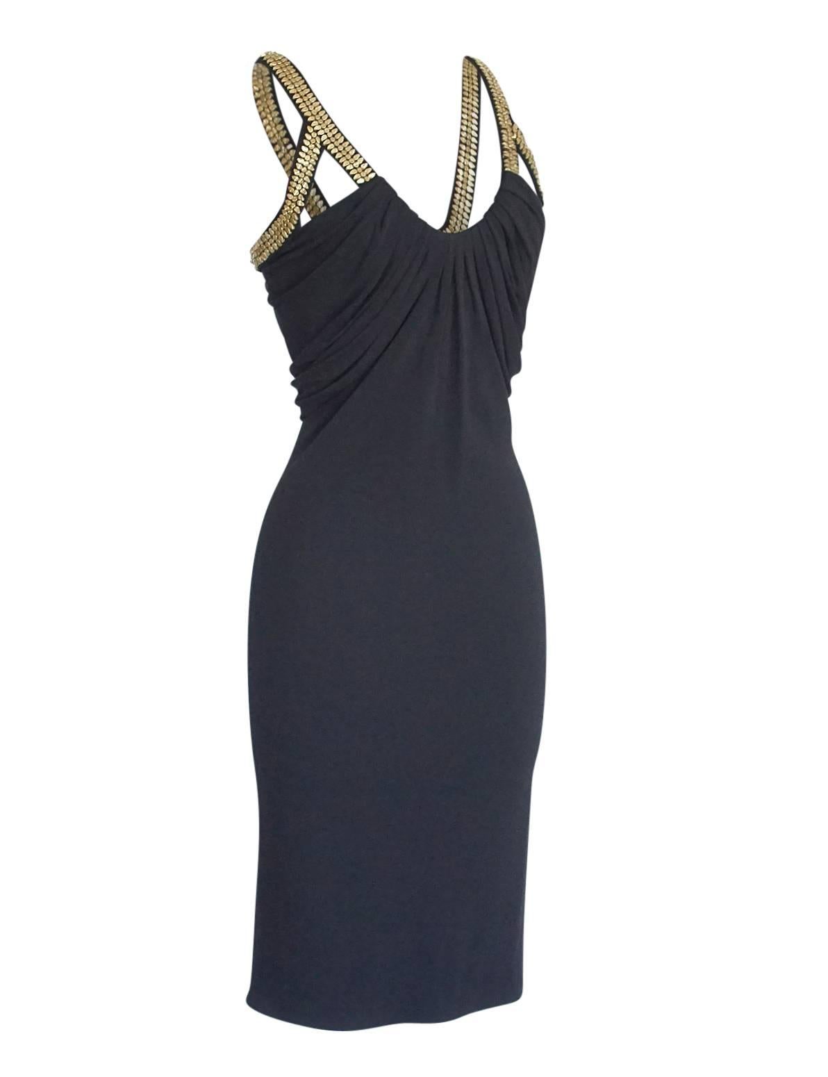 Guaranteed authentic Versace dress with unique engraved gold metal around arm and on straps.
Jet black jersey scoop neck with gorgeous draping around the top. 
Soft shaping, very feminine and figure flattering. 
Fabric is silk and rayon and has