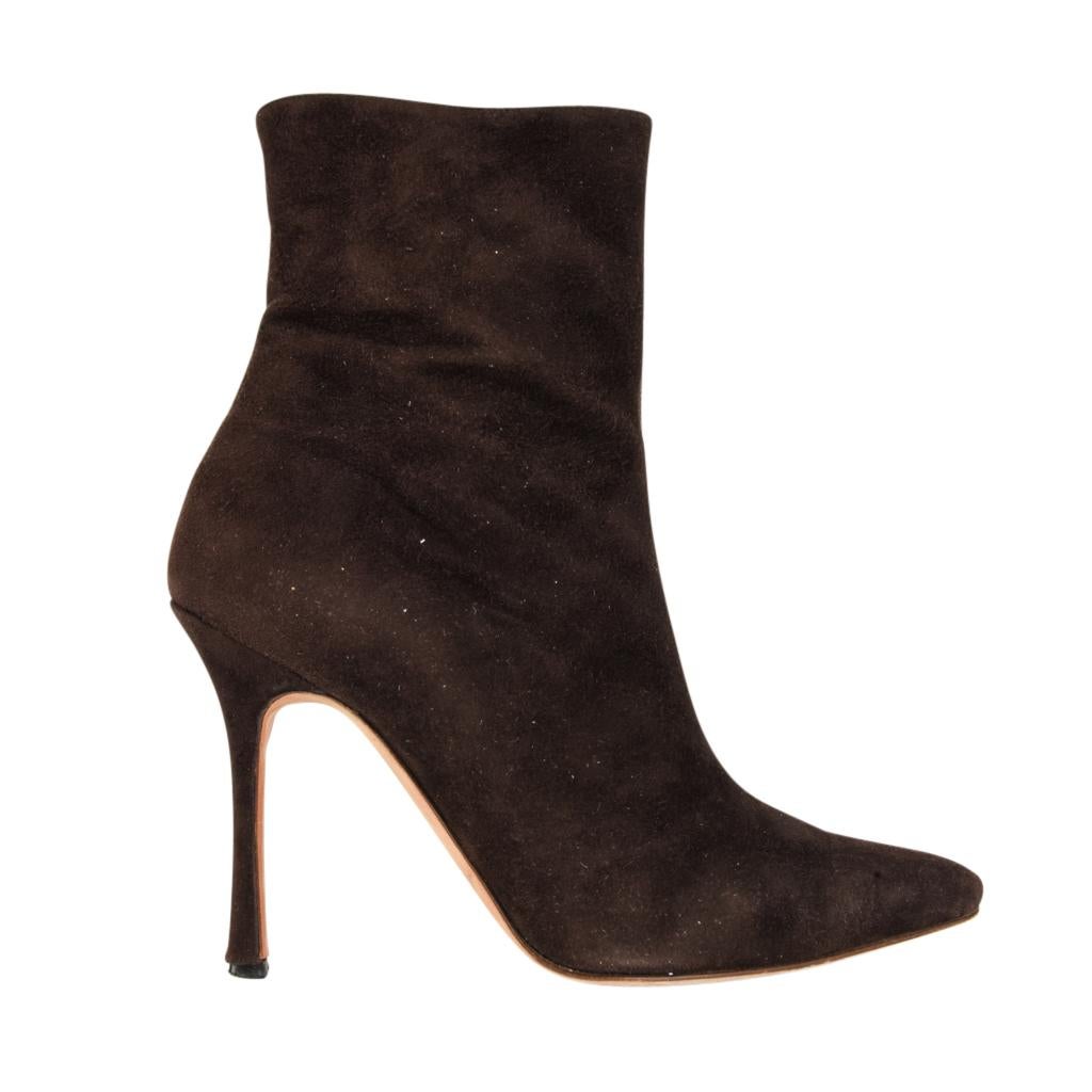 Guaranteed authentic Manolo Blahnik sleek chocolate brown super soft suede ankle boot with signature high heel.
Pointed toe is softly rounded.  Soft stitch center seam. 
Suede heel.   
Zipper for easy access. 
final sale

SIZE 36.5
USA SIZE 