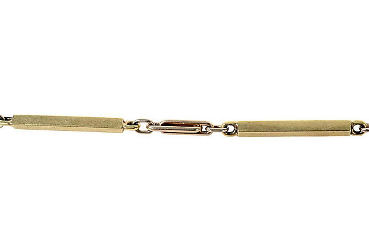 14K yellow gold watch chain with smooth and off-set split gold bars and chain. Weight: 12.6 grams. Marked: 14K. Age wear.
N.P. Trent has been a respected name in antiques for over 30 years with a large collection of antique and vintage fashion and