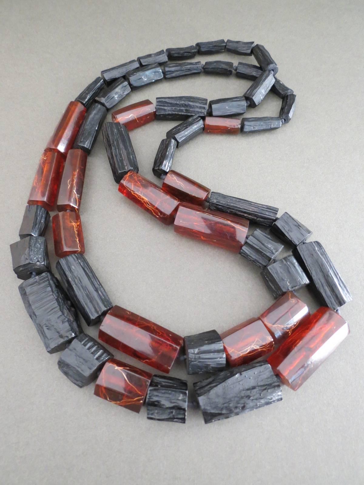 This is lovely long Danish Monies necklace designed by Gerda Lynggaard . This necklace is made of pressed baltic amber and wood imitation lucite. The necklace is not signed.
Item Specifics
Length: 150cm (approx 58.50
