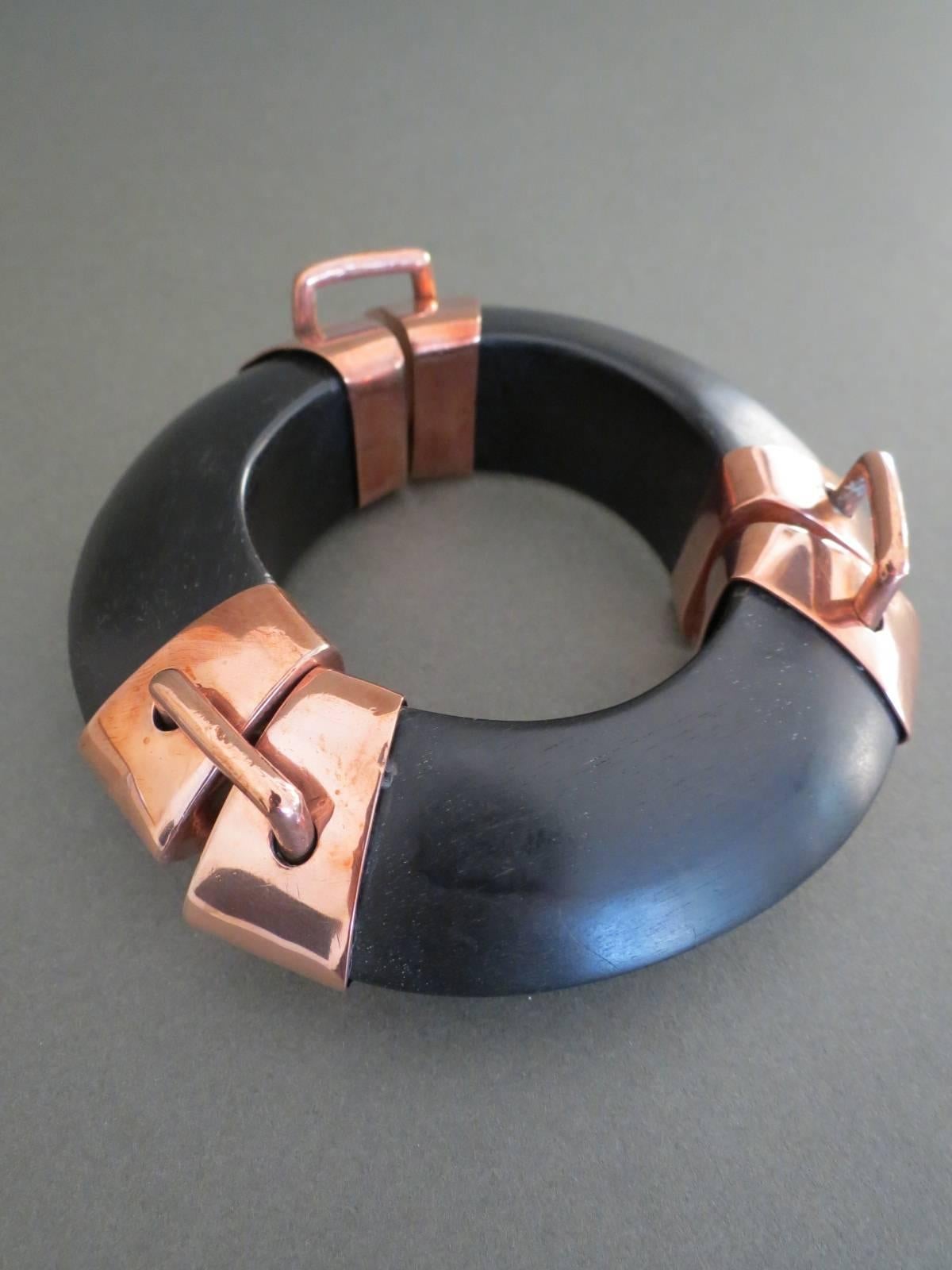 This is lovely large vintage Danish Monies bangle designed by Gerda Lynggaard.
The bangle is made of ebony and metal. It is not signed.
Item Specifics
Width: 3.4cm (approx 1.50