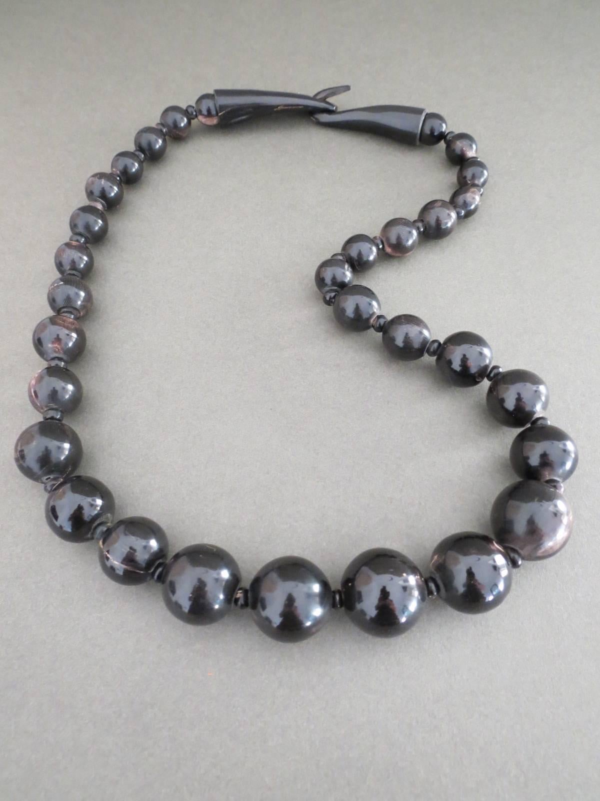 This is lovely Vintage Danish Monies necklace designed by Gerda Lynggaard . The necklace is made of bovine horn.
Item Specifics
Length: 77cm (approx 30.00