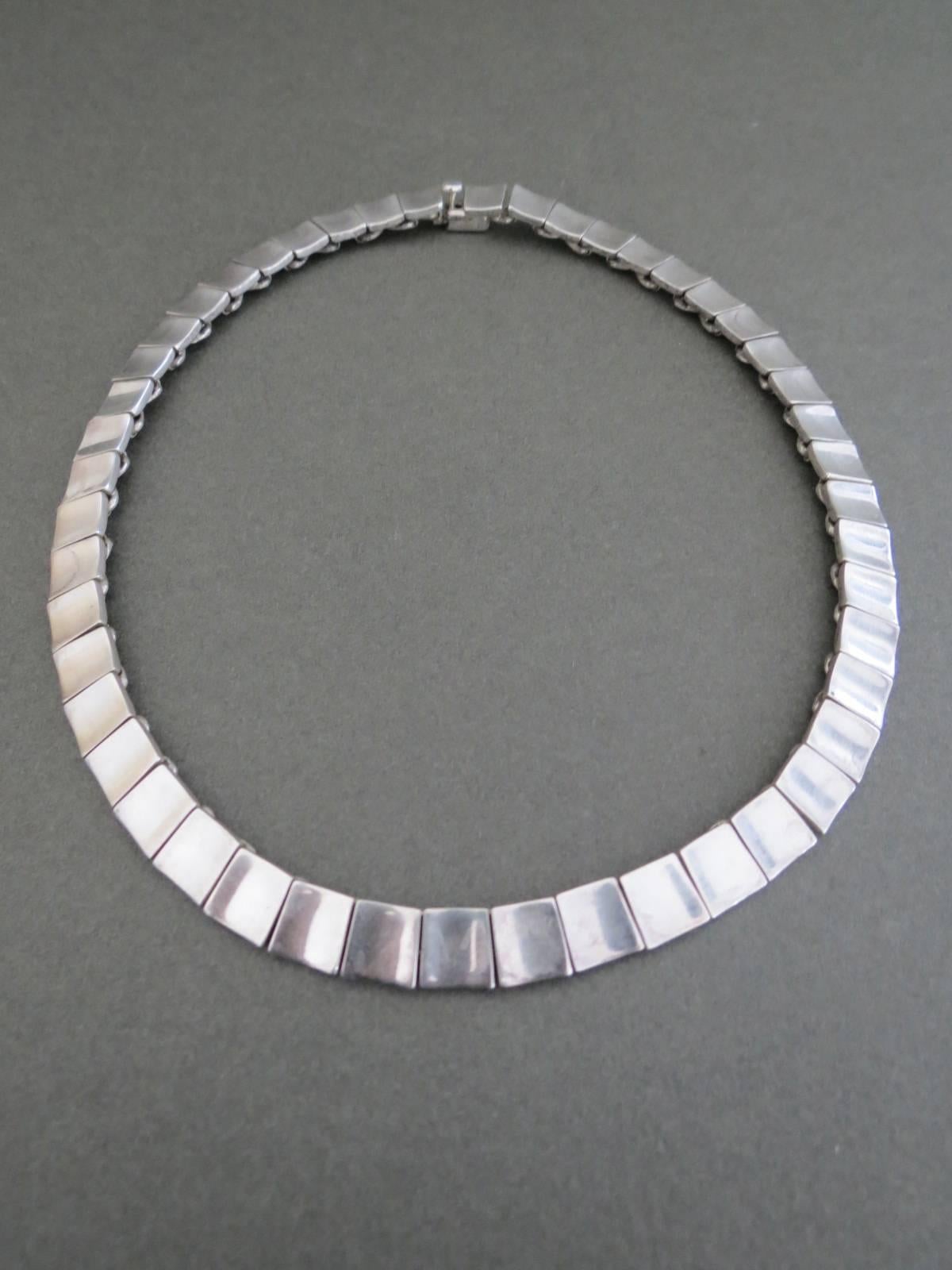 Vintage Sterling Silver Modernist Necklace. The necklace has age related ware . It is hallmarked. 
Items Specifics
Length: 48cm (approx 18.50