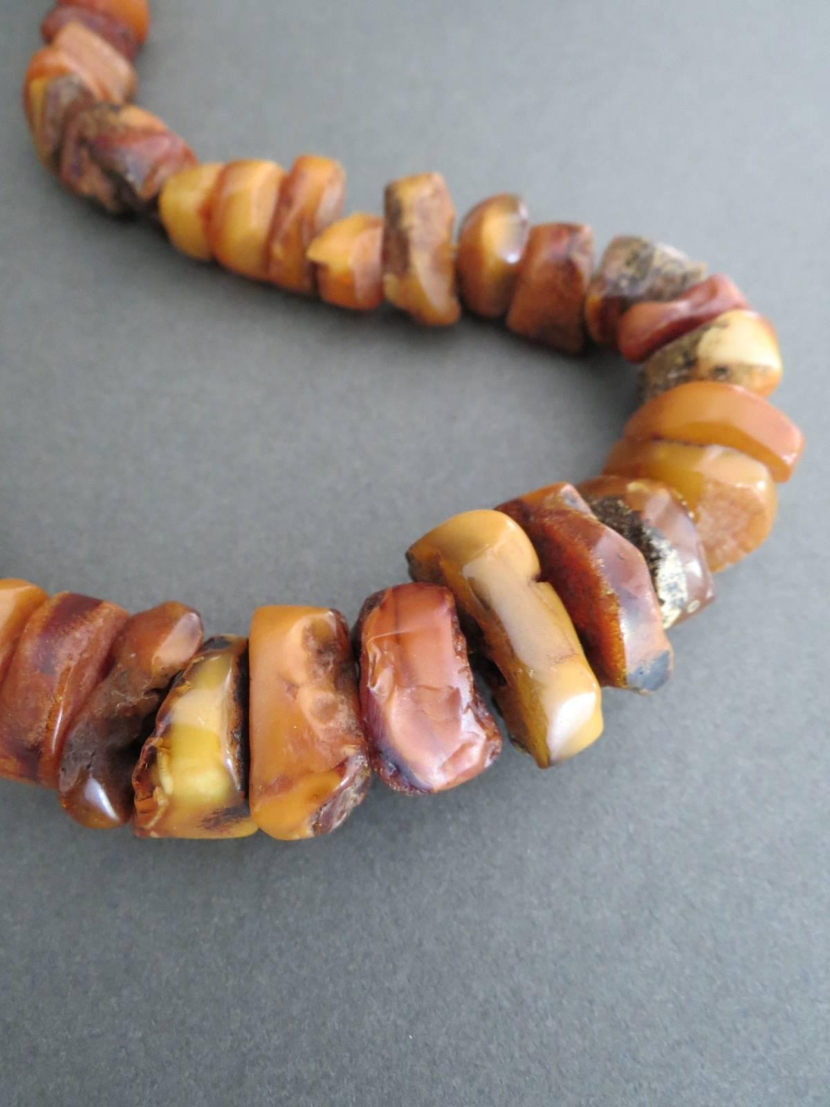 This is lovely large natural rustic baltic amber necklace and in good vintage condition. Amazing hand made beads and finished with vintage clasp. The necklace is restrung that it would be safe to wear .
Item Specifics
Length: 49cm (approx