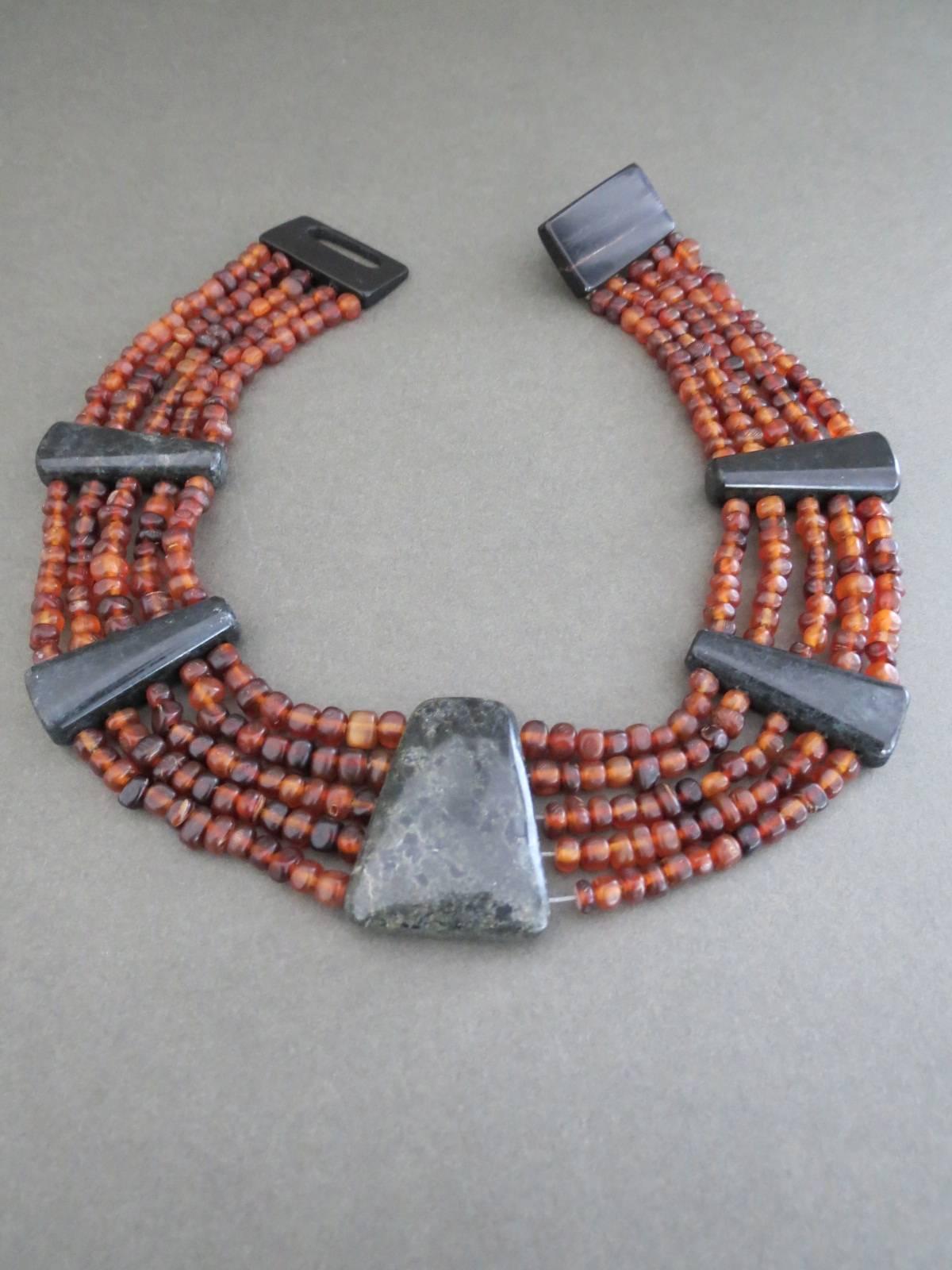 This is lovely Danish Monies necklace designed by Gerda Lynggaard . Necklace is made of Soldalite ,Baltic Amber and Horn. Lovely condition.
Item Specifics
Length: 40cm (approx 15.50