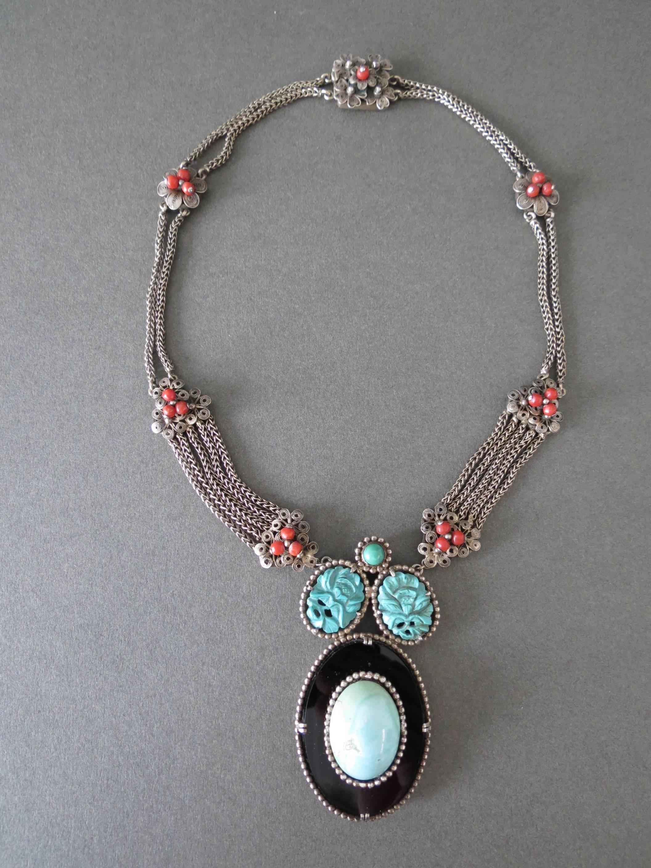 This is lovely greenish carved turquoise , blue turquoise , onyx and coral filigree silver necklace most likely originated in 1920-30's China. Absolutely amazing piece . Not hallmarked but tested .
Item Specifics
Full length: 47cm (approx