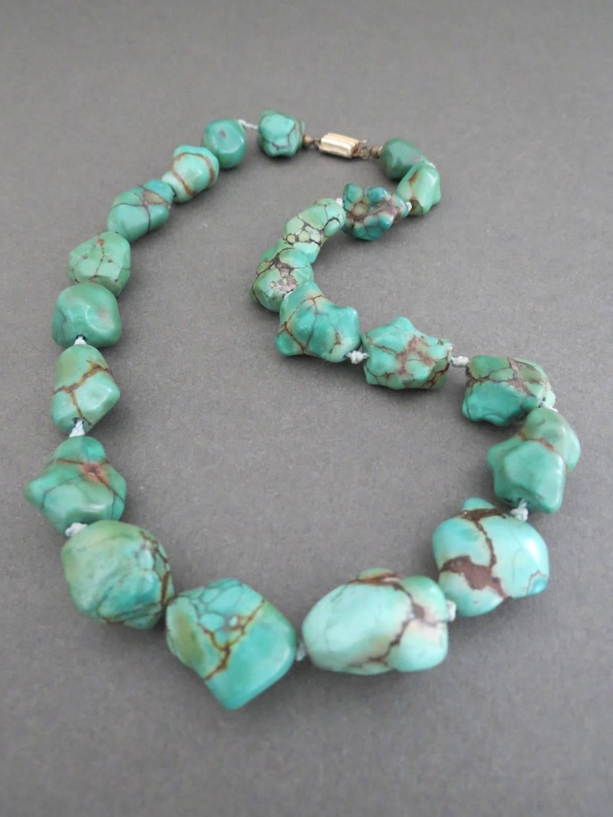 This lovely turquoise nugget bead necklace is from China. The necklace has pretty decorated clasp . The clasp functions well . Hallmarked.
Item Specifics
Length: 46cm (approx 18.00