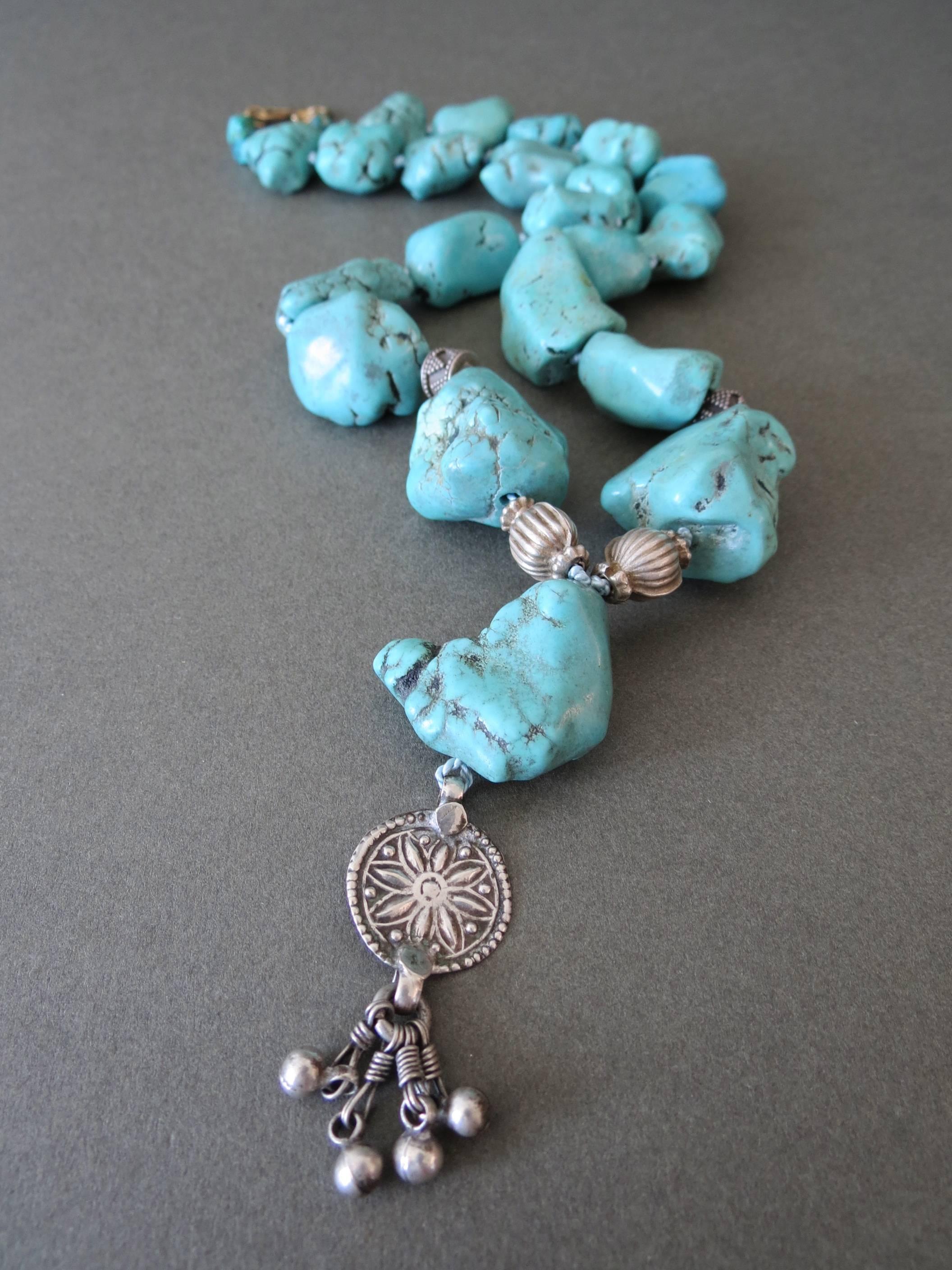 This lovely long and heavy blue turquoise nugget bead necklace . The necklace has pretty decorated silver filigree details . It has been restrung.
Item Specifics
Full length: 63cm (approx 24.50