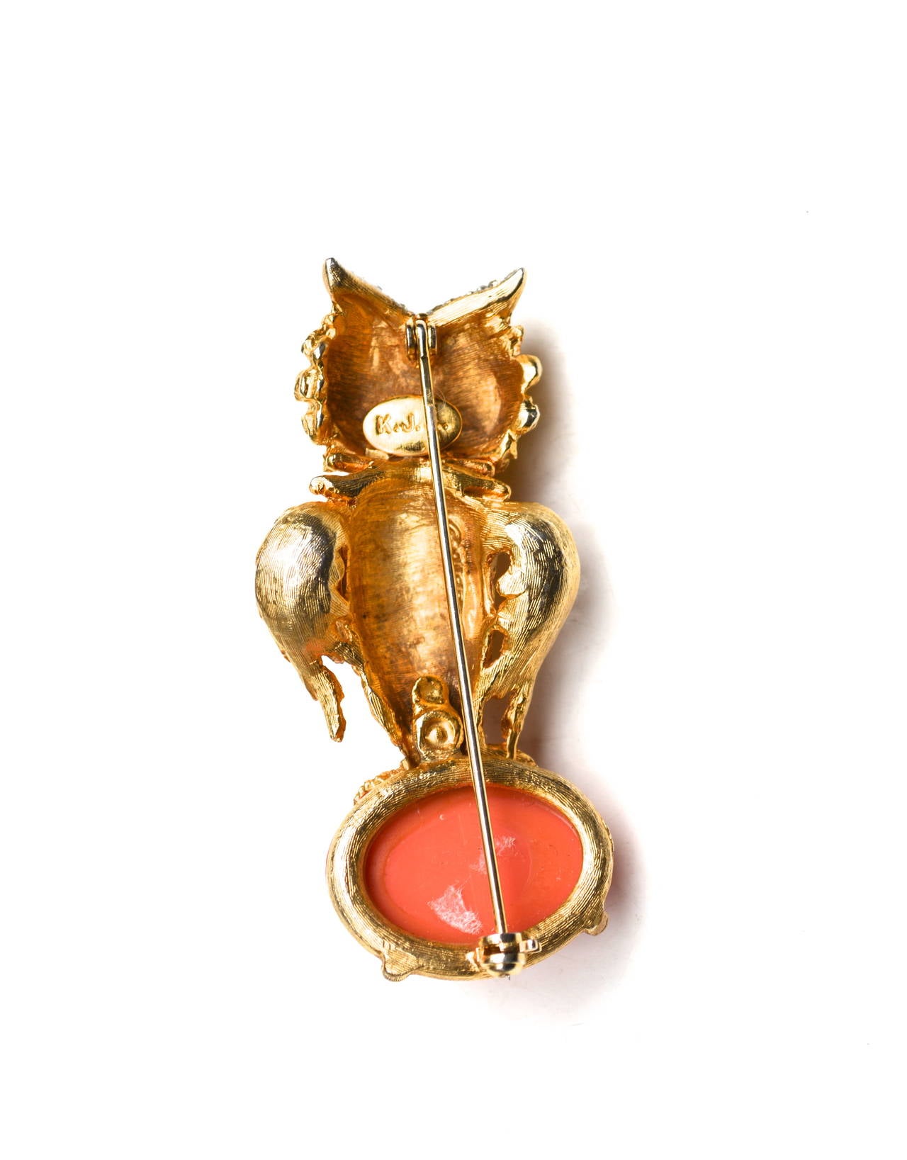 Produced in the 1960s, it is signed K.J.L and this early golden owl has glass and lucite details. The whimsical fellow features fun colors and has a great scale at 2.5