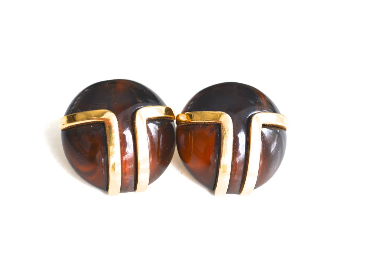 Vintage signed designer Lanvin clip earrings. Great desirable era design. Deep coffee and cappuccino toned lucite and golden mod logo accent metal design.